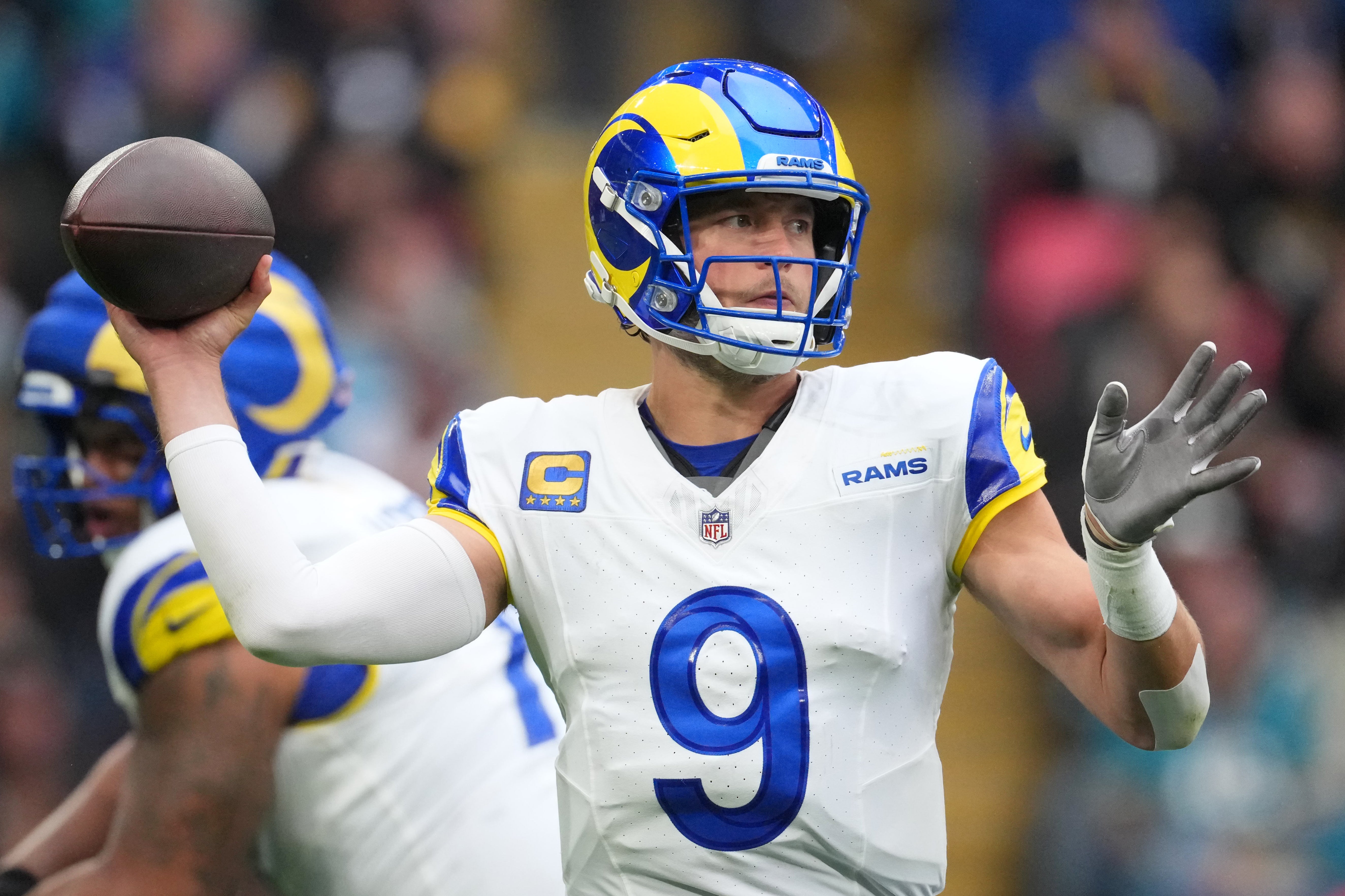 Oct 19, 2025; London, United Kingdom; Los Angeles Rams quarterback Matthew Stafford (9) passes the ball against the Jacksonville Jaguars during the first half of an NFL International Series game at Wembley Stadium. Mandatory Credit: Kirby Lee-Imagn Images