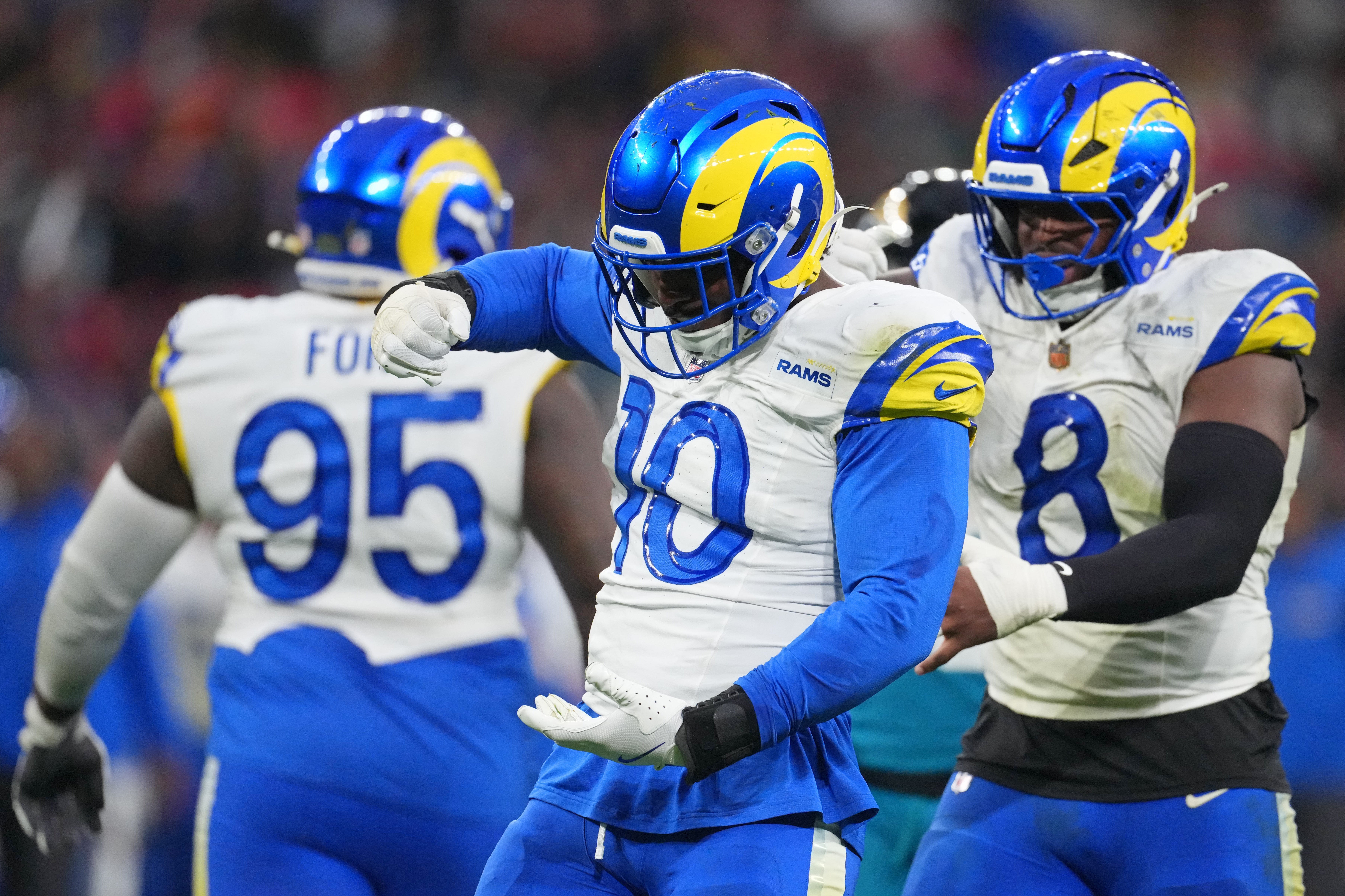 Oct 19, 2025; London, United Kingdom; Los Angeles Rams linebacker Josaiah Stewart (10) and linebacker Jared Verse (8) reacts after a play against the Jacksonville Jaguars during the second half of an NFL International Series game at Wembley Stadium.