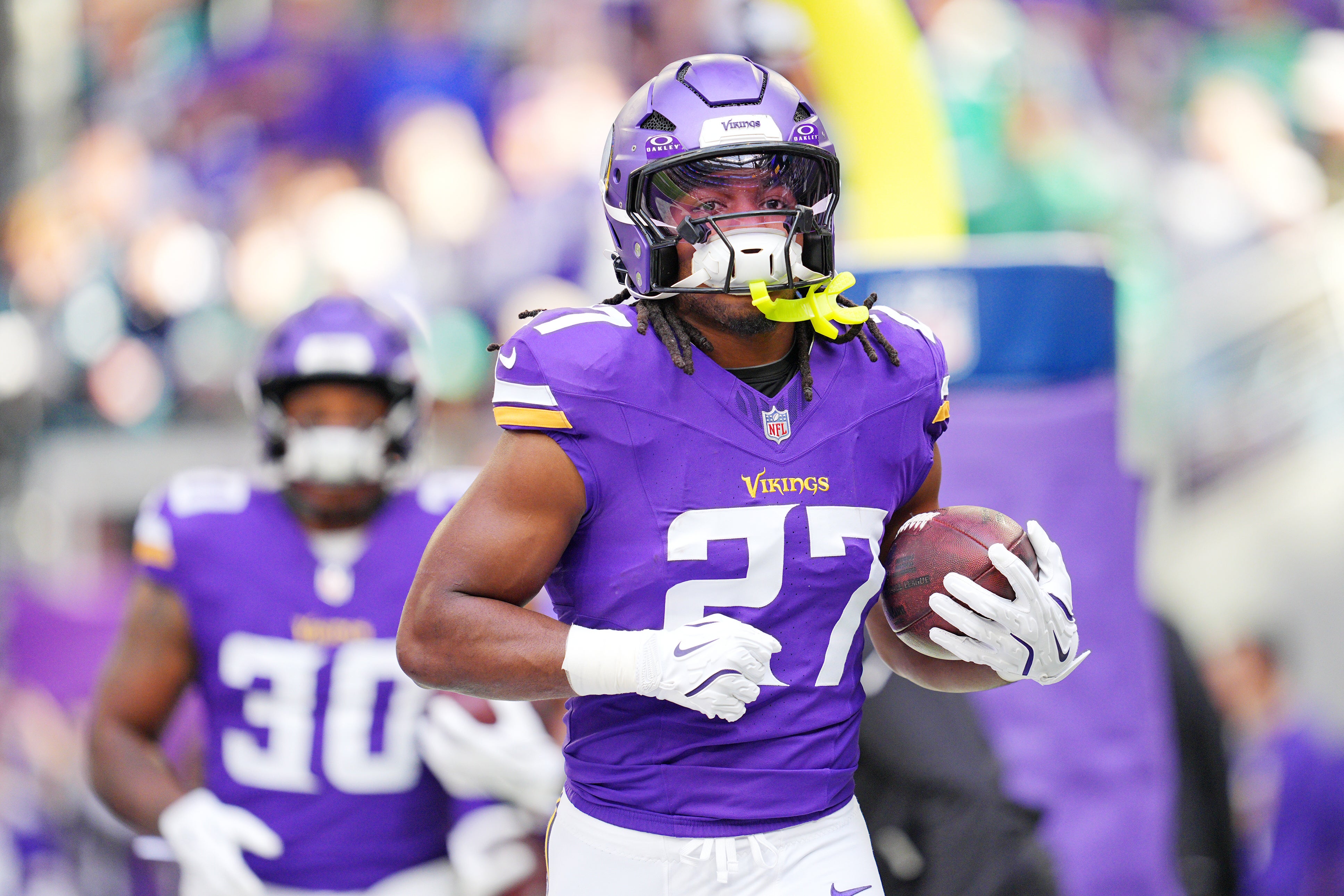 Oct 19, 2025; Minneapolis, Minnesota, USA; Minnesota Vikings running back Jordan Mason (27) warms up before the game against the Philadelphia Eagles at U.S. Bank Stadium.