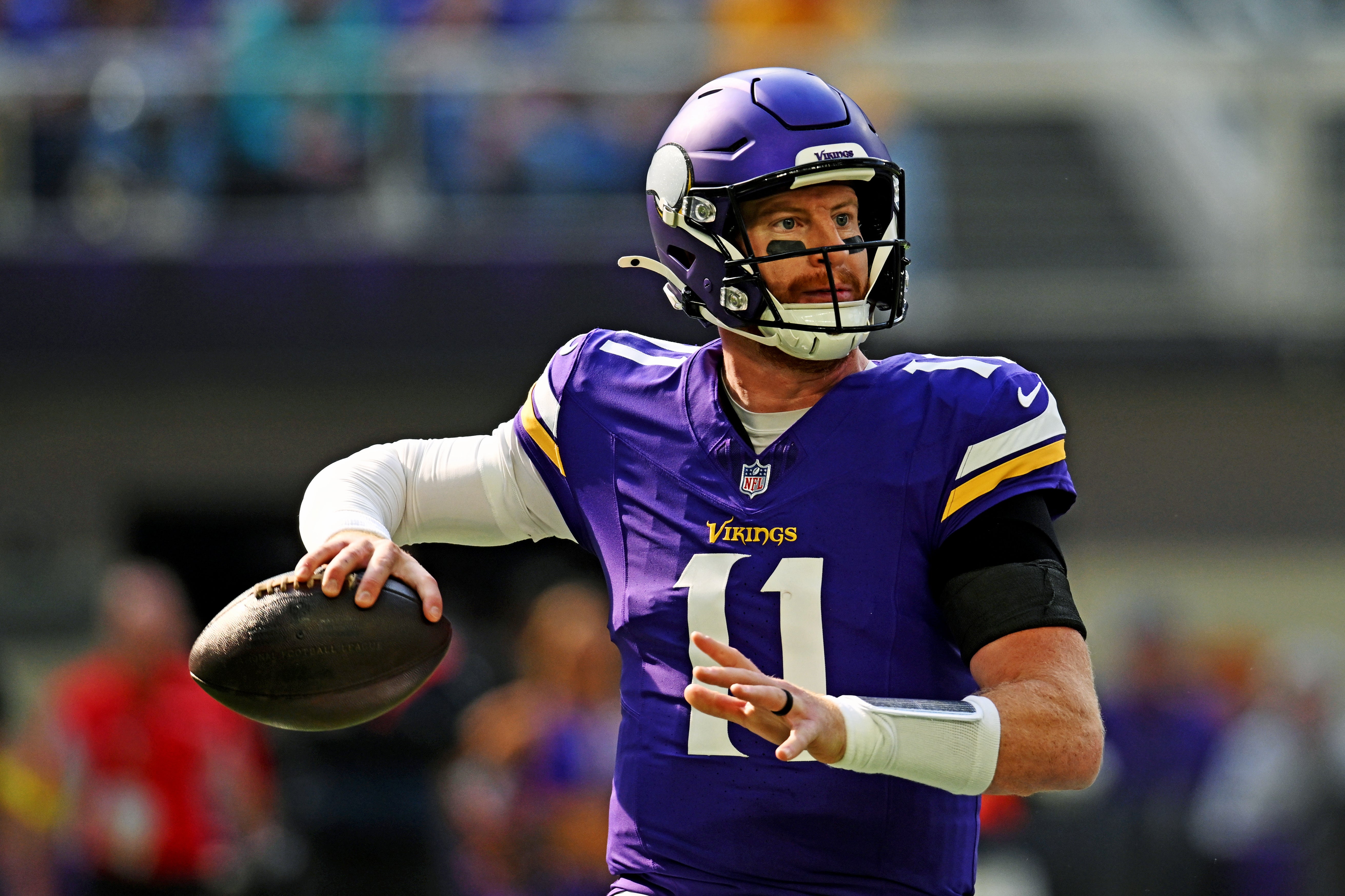 Oct 19, 2025; Minneapolis, Minnesota, USA; Minnesota Vikings quarterback Carson Wentz (11) makes a pass during the first half against the Philadelphia Eagles at U.S. Bank Stadium.