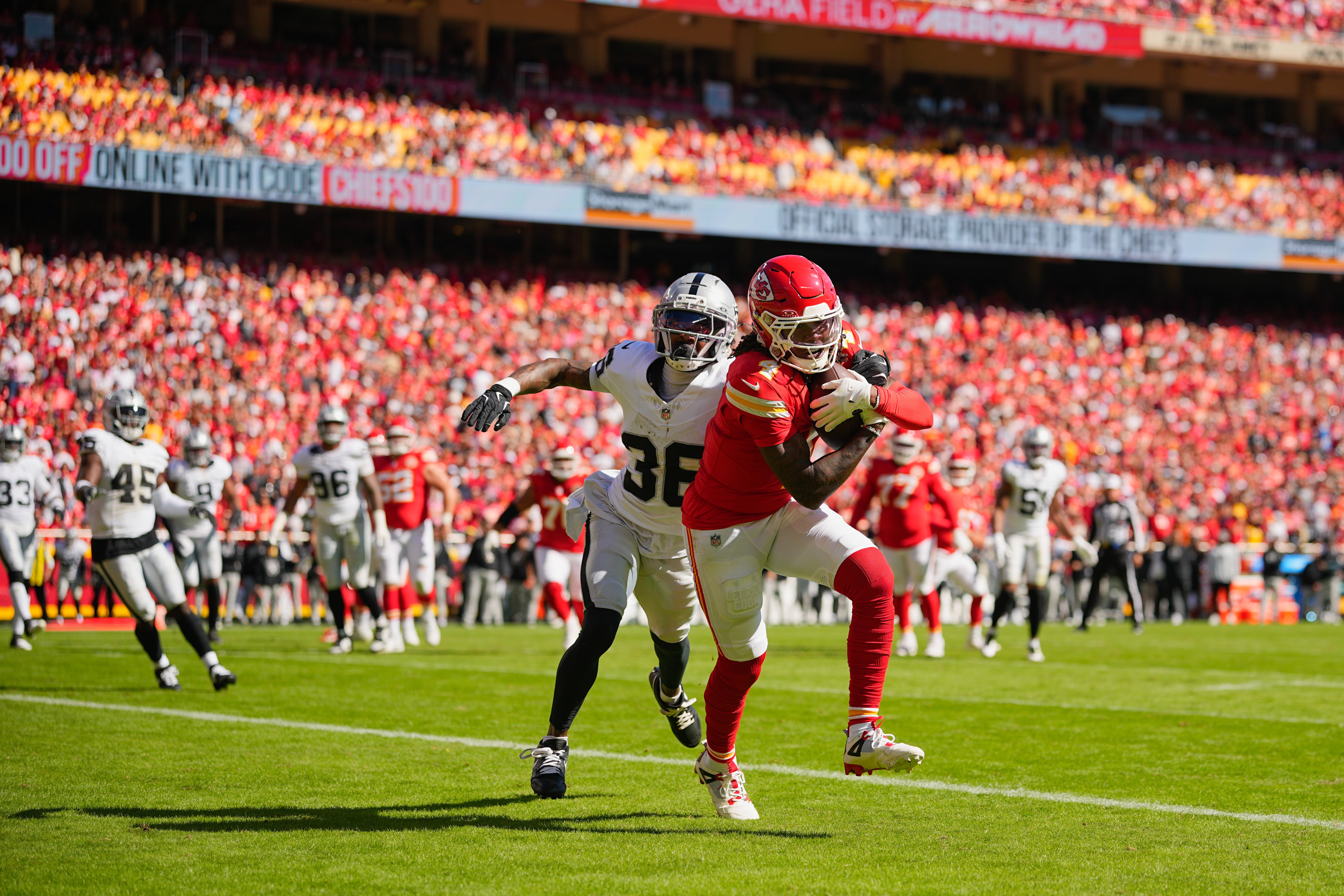 Kansas City Chiefs wide receiver Rashee Rice (4) makes a reception for a touchdown defended by Las Vegas Raiders cornerback Kyu Blu Kelly (36)