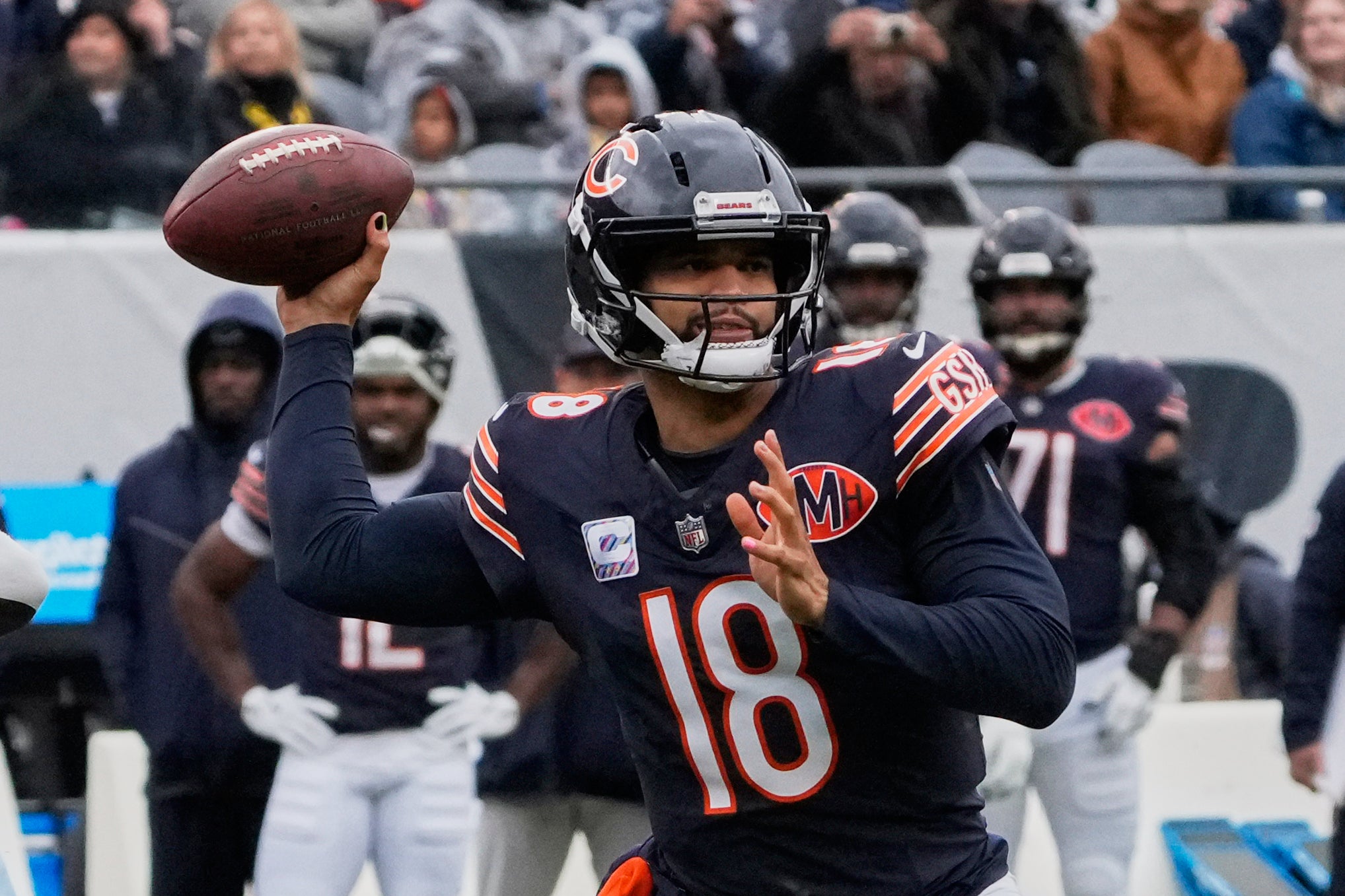 Oct 19, 2025; Chicago, Illinois, USA; Chicago Bears quarterback Caleb Williams (18) throws a pass against the New Orleans Saints during the first half at Soldier Field.