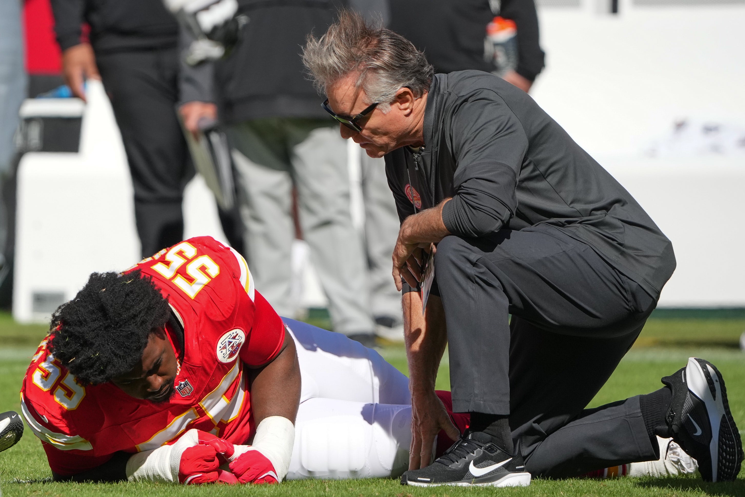 Kansas City Chiefs defensive tackle Omarr Norman-Lott (55) is checked on by a trainer after an injury against the Las Vegas Raiders