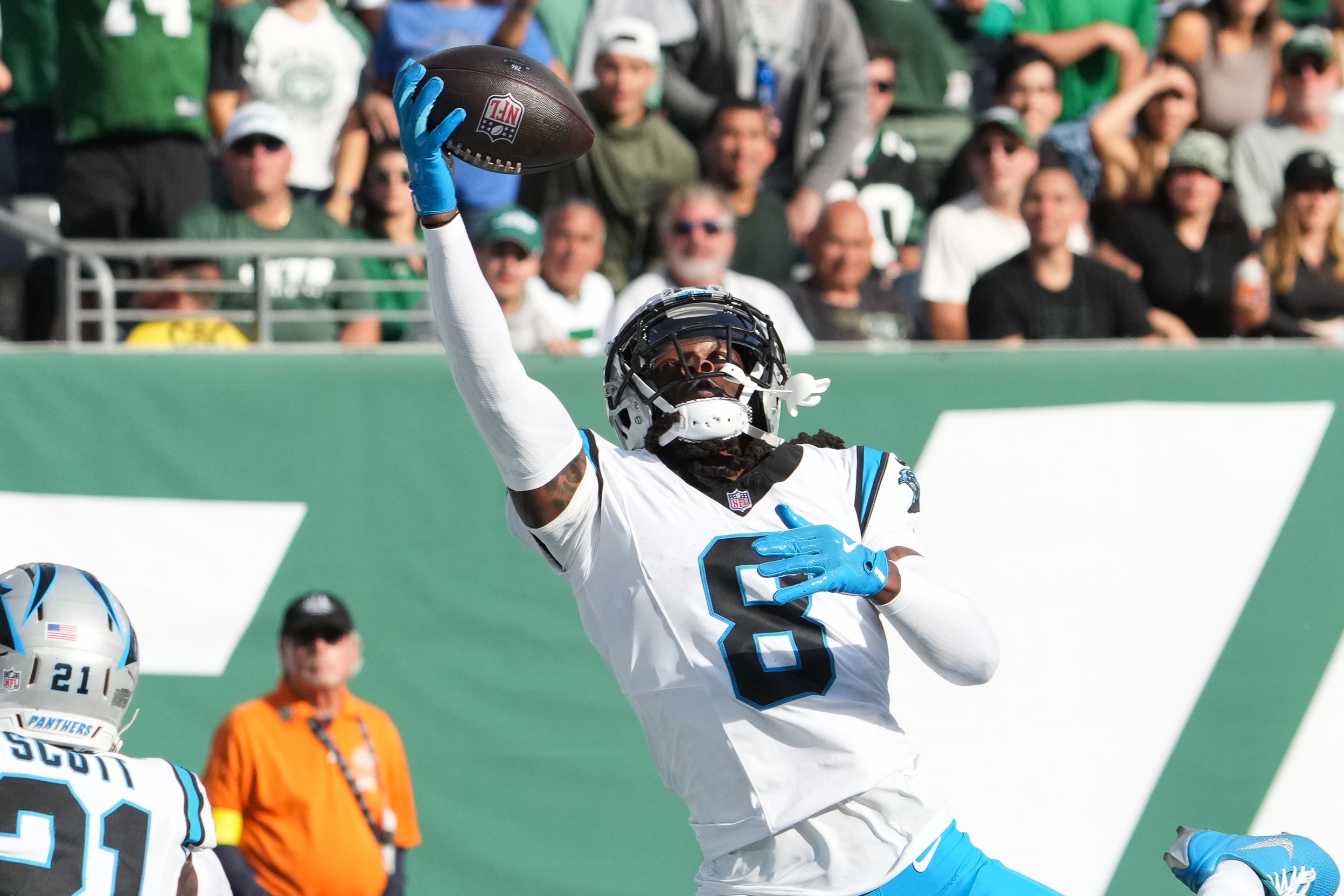 Oct 19, 2025; East Rutherford, New Jersey, USA; Carolina Panthers cornerback Jaycee Horn (8) intercepts a pass during the third quarter against the New York Jets at MetLife Stadium.