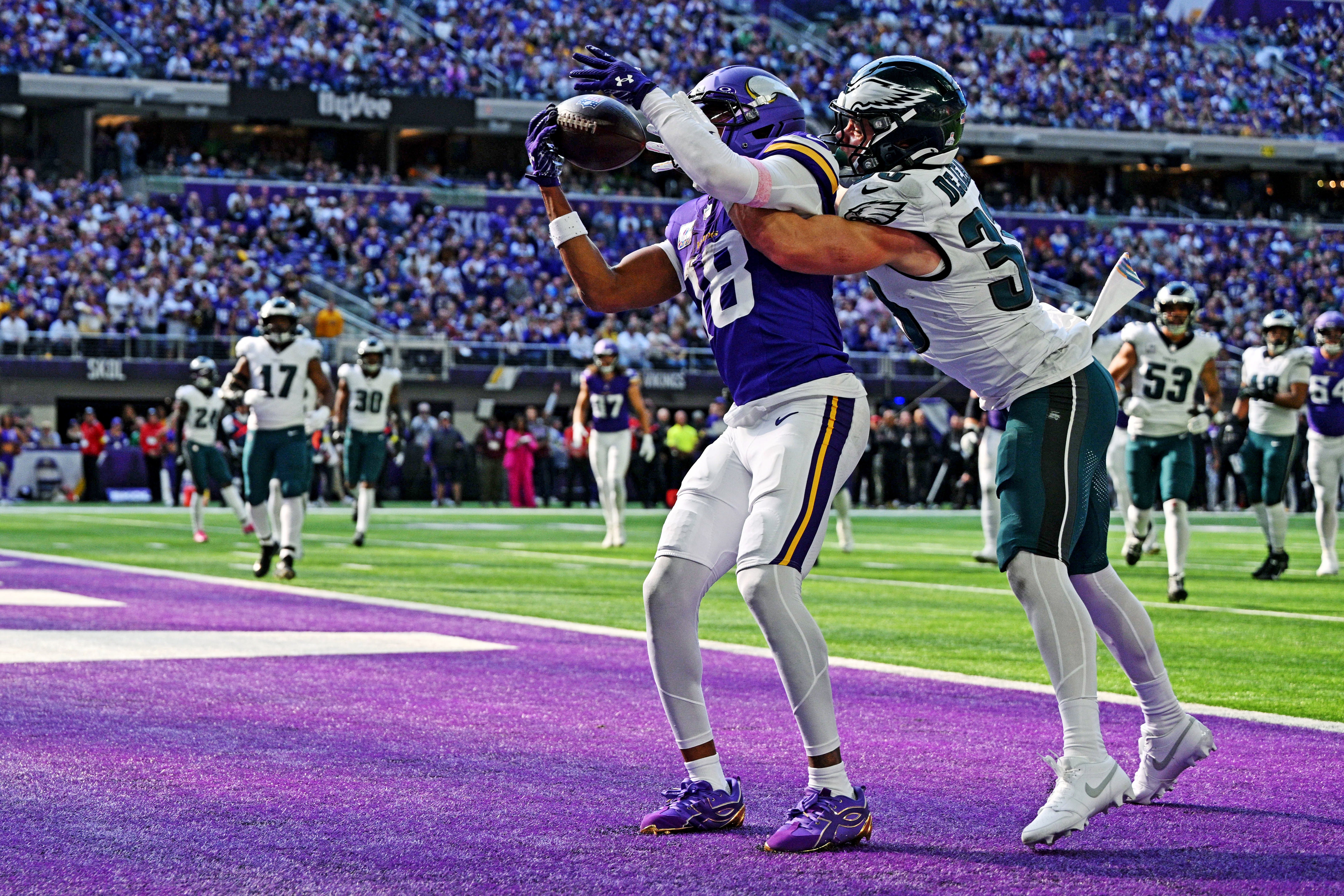 Oct 19, 2025; Minneapolis, Minnesota, USA; Minnesota Vikings wide receiver Justin Jefferson (18) is unable to make a catch during the second half after being blocked by Philadelphia Eagles cornerback Cooper Dejean (33) at U.S. Bank Stadium.