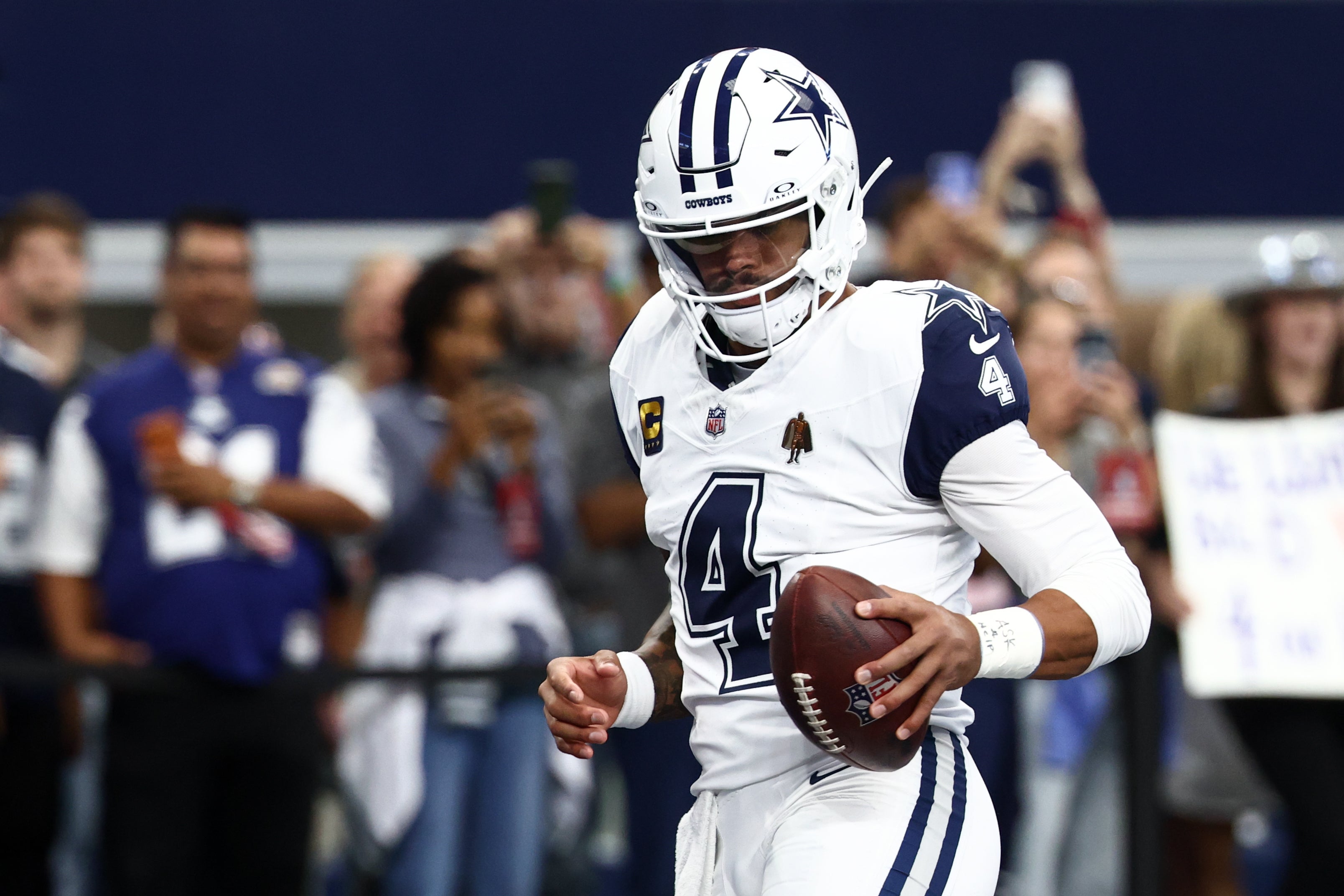 Oct 19, 2025; Arlington, Texas, USA; Dallas Cowboys quarterback Dak Prescott (4) warms up prior to the game against the Washington Commanders at AT&T Stadium.