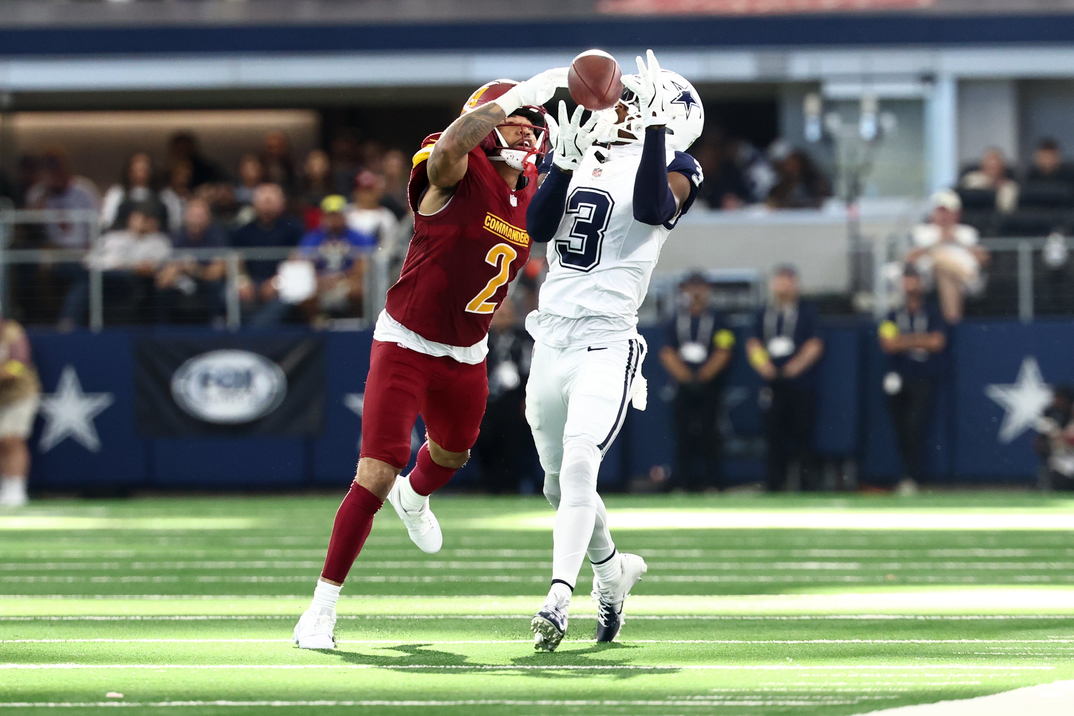 Oct 19, 2025; Arlington, Texas, USA; Dallas Cowboys wide receiver George Pickens (3) makes a reception defended by Washington Commanders cornerback Marshon Lattimore (2) during the second quarter of the game at AT&T Stadium.