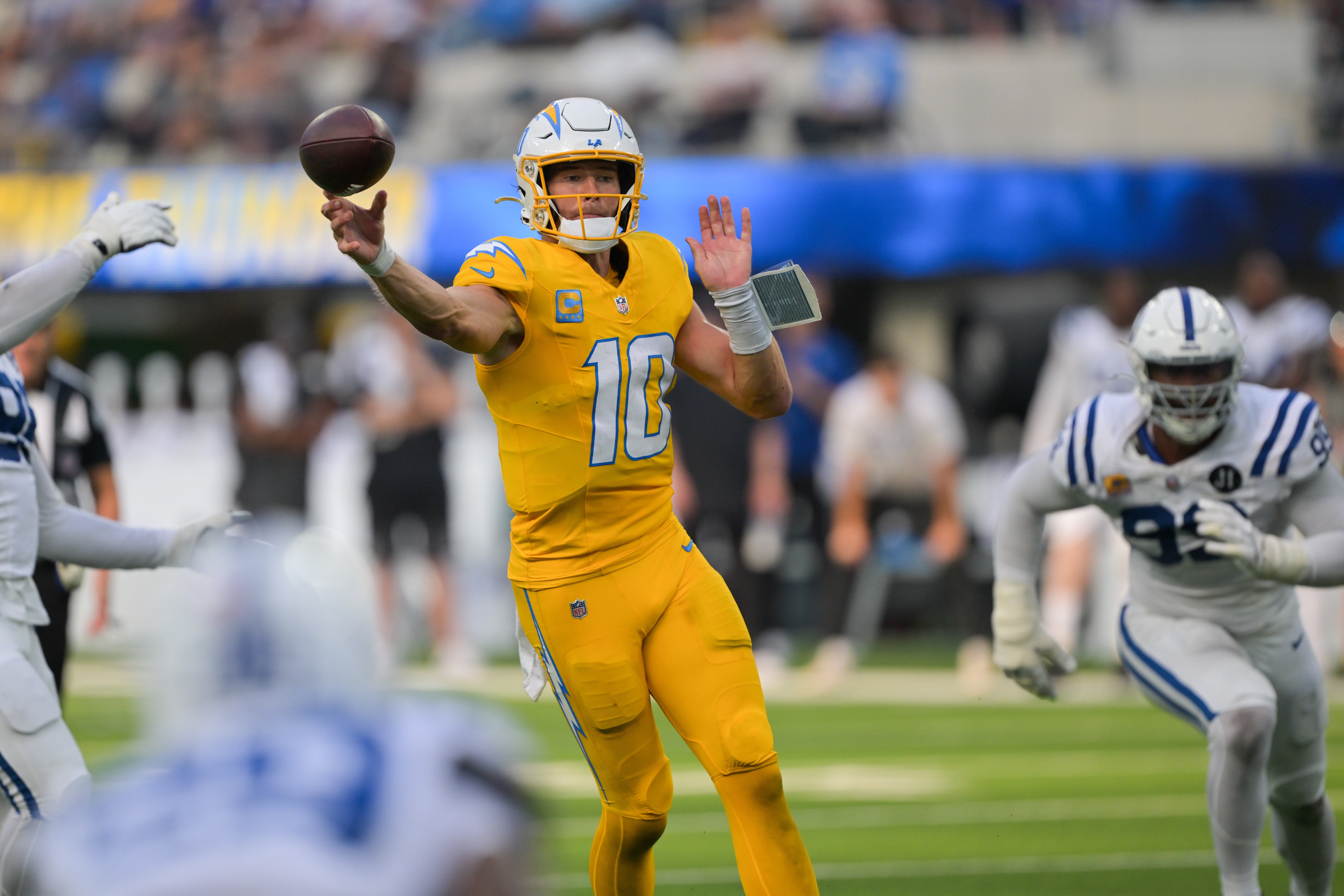 Los Angeles Chargers quarterback Justin Herbert (10) throws the ball for a touchdown in the second half against the Indianapolis Colts at SoFi Stadium