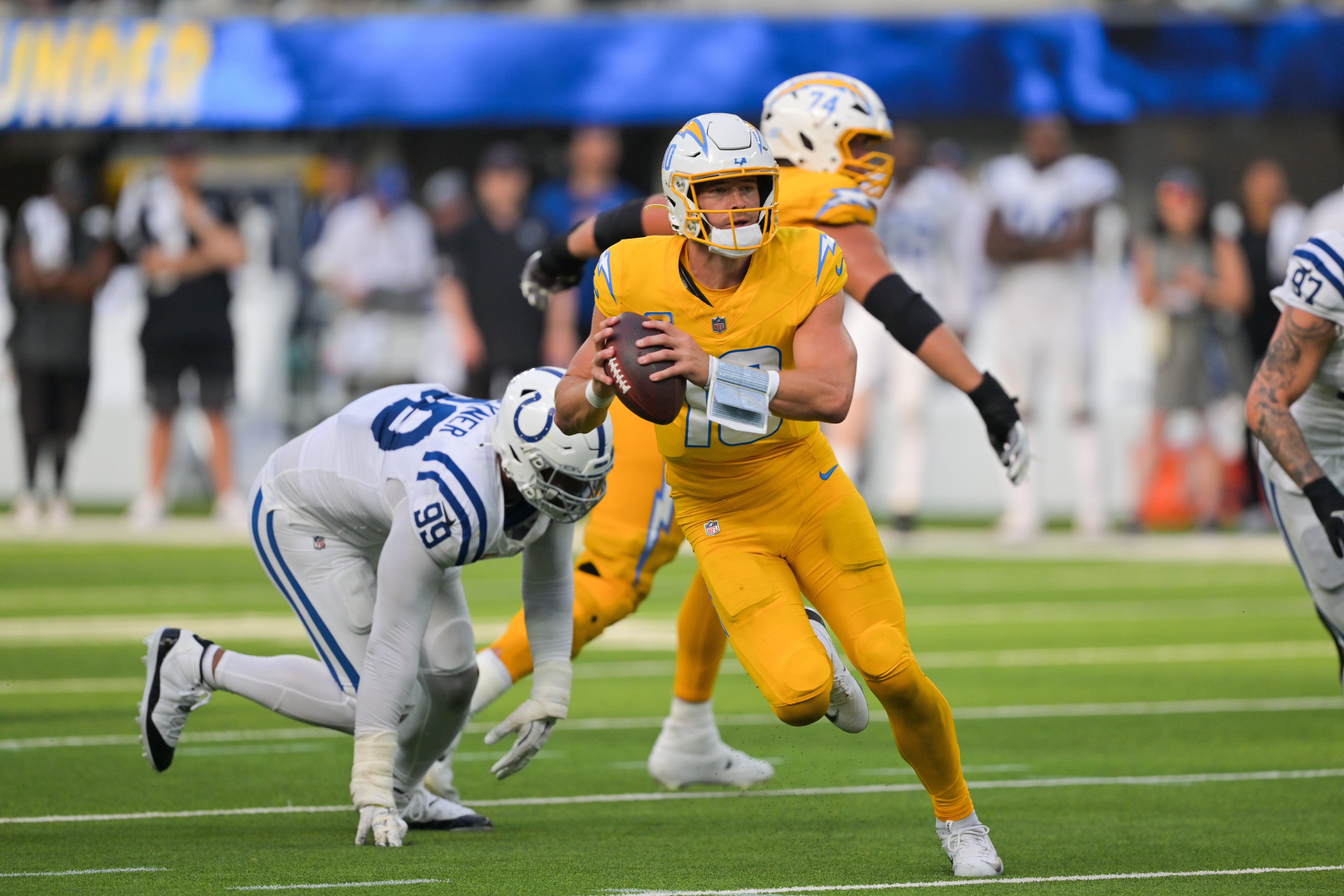 Oct 19, 2025; Inglewood, California, USA; Los Angeles Chargers quarterback Justin Herbert (10) moves the ball in the second half against the Indianapolis Colts at SoFi Stadium.
