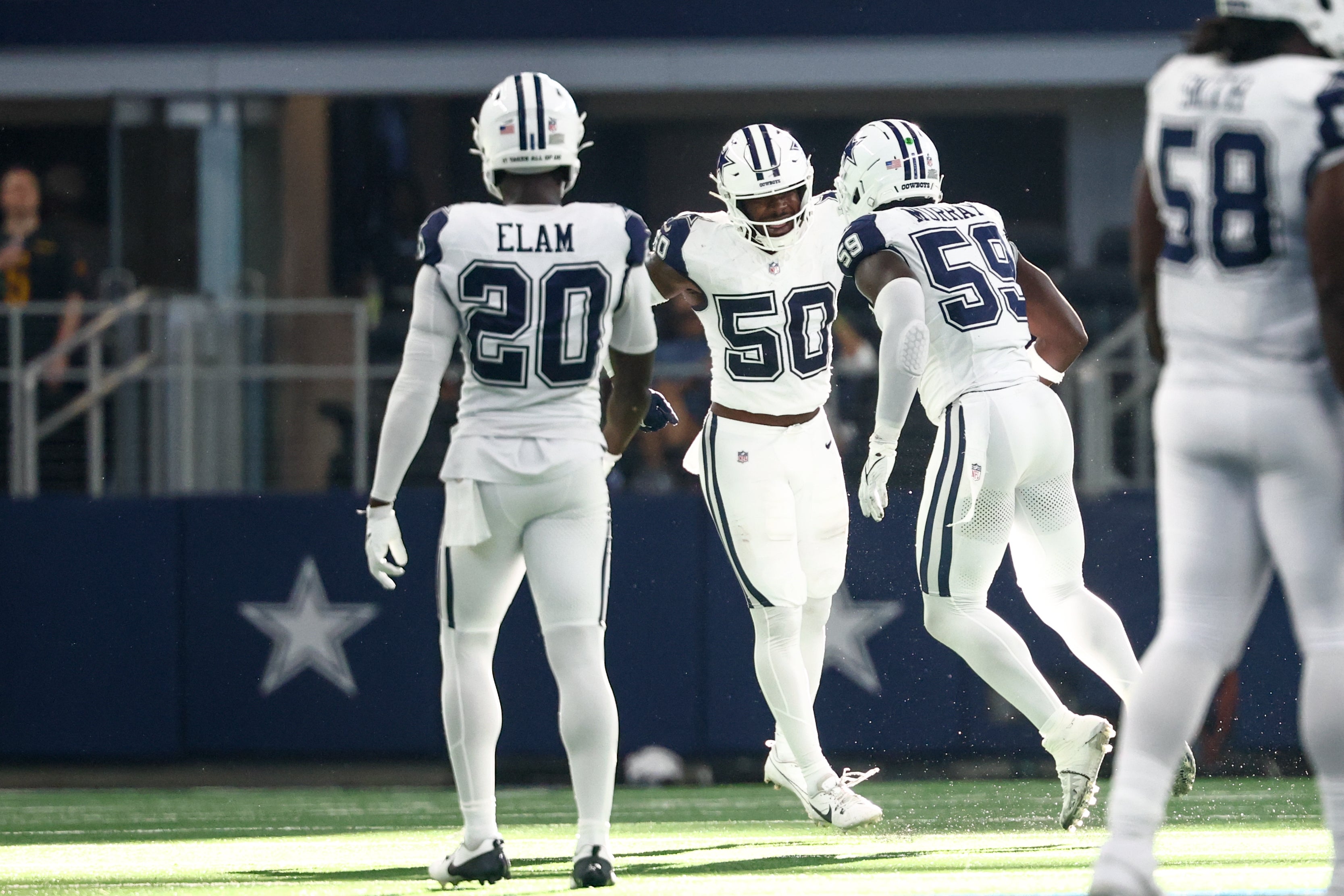 Oct 19, 2025; Arlington, Texas, USA; Dallas Cowboys linebacker Shemar James (50) and linebacker Jr. Kenneth Murray (59) celebrate after a fumble by the Washington Commanders during the third quarter of the game at AT&T Stadium.
