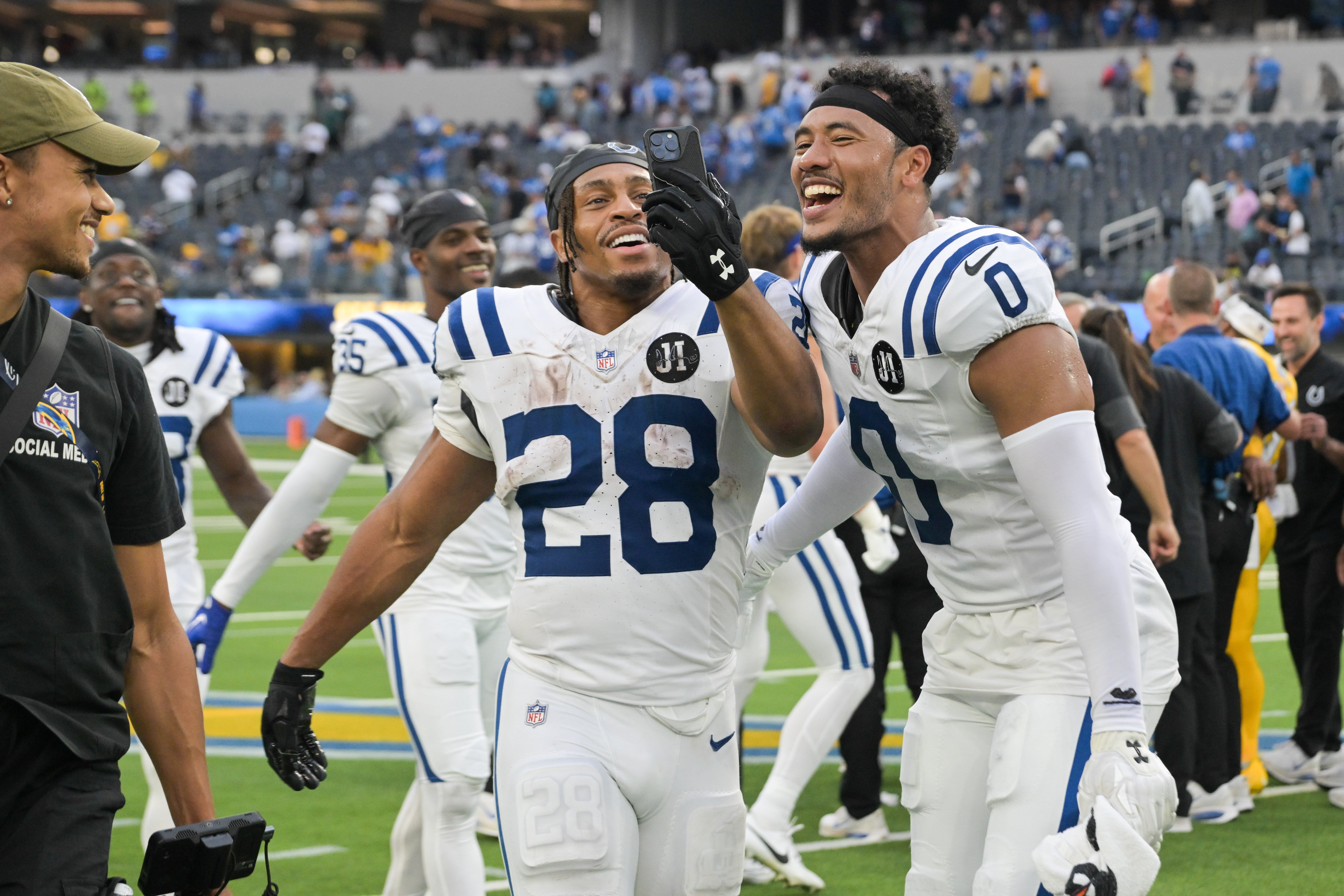 Colts RB Jonathan Taylor and S Cam Bynum celebrate win over Chargers