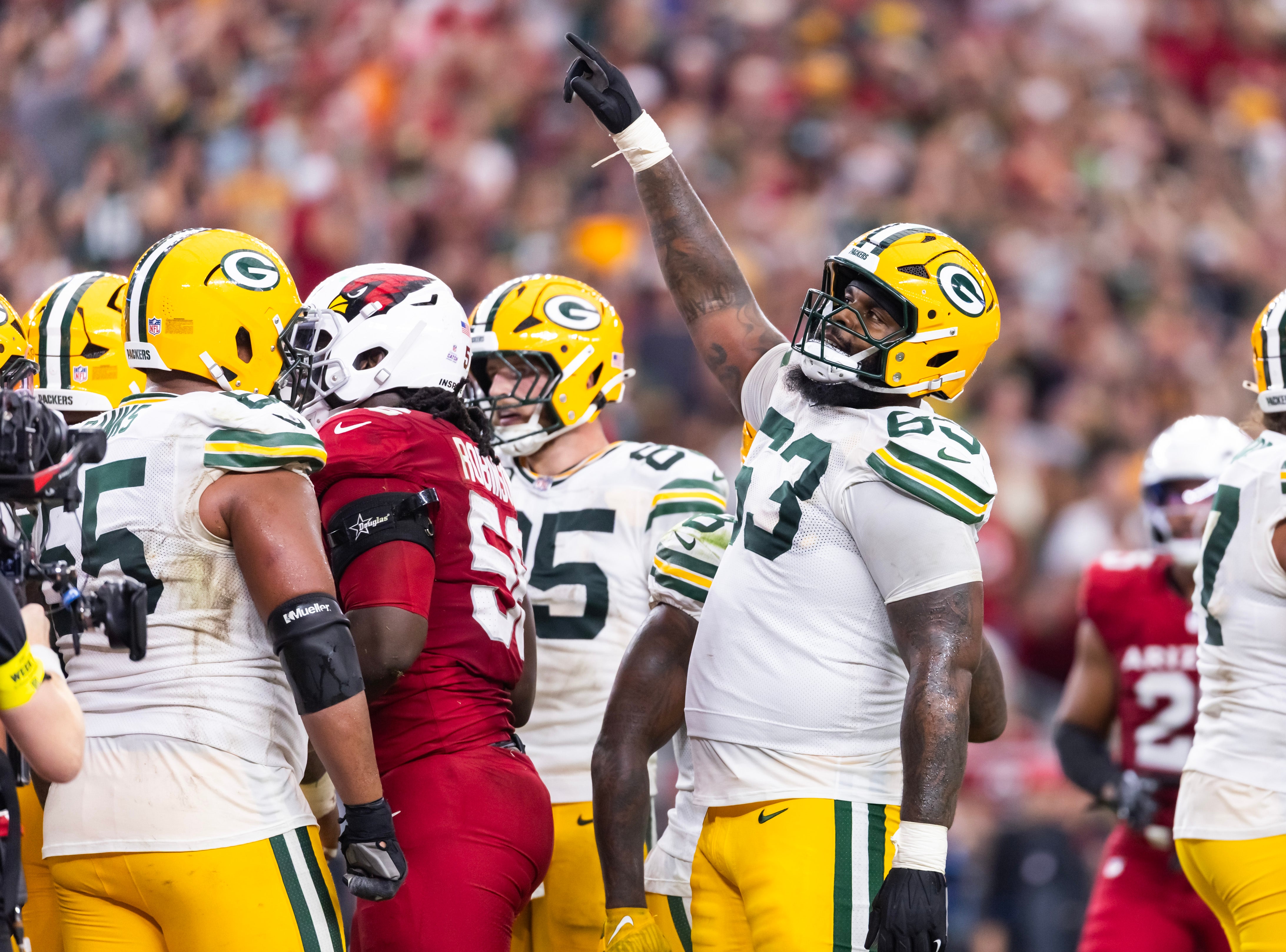 Oct 19, 2025; Glendale, Arizona, USA; Green Bay Packers tackle Rasheed Walker (63) celebrates a play against the Arizona Cardinals in the second half at State Farm Stadium.