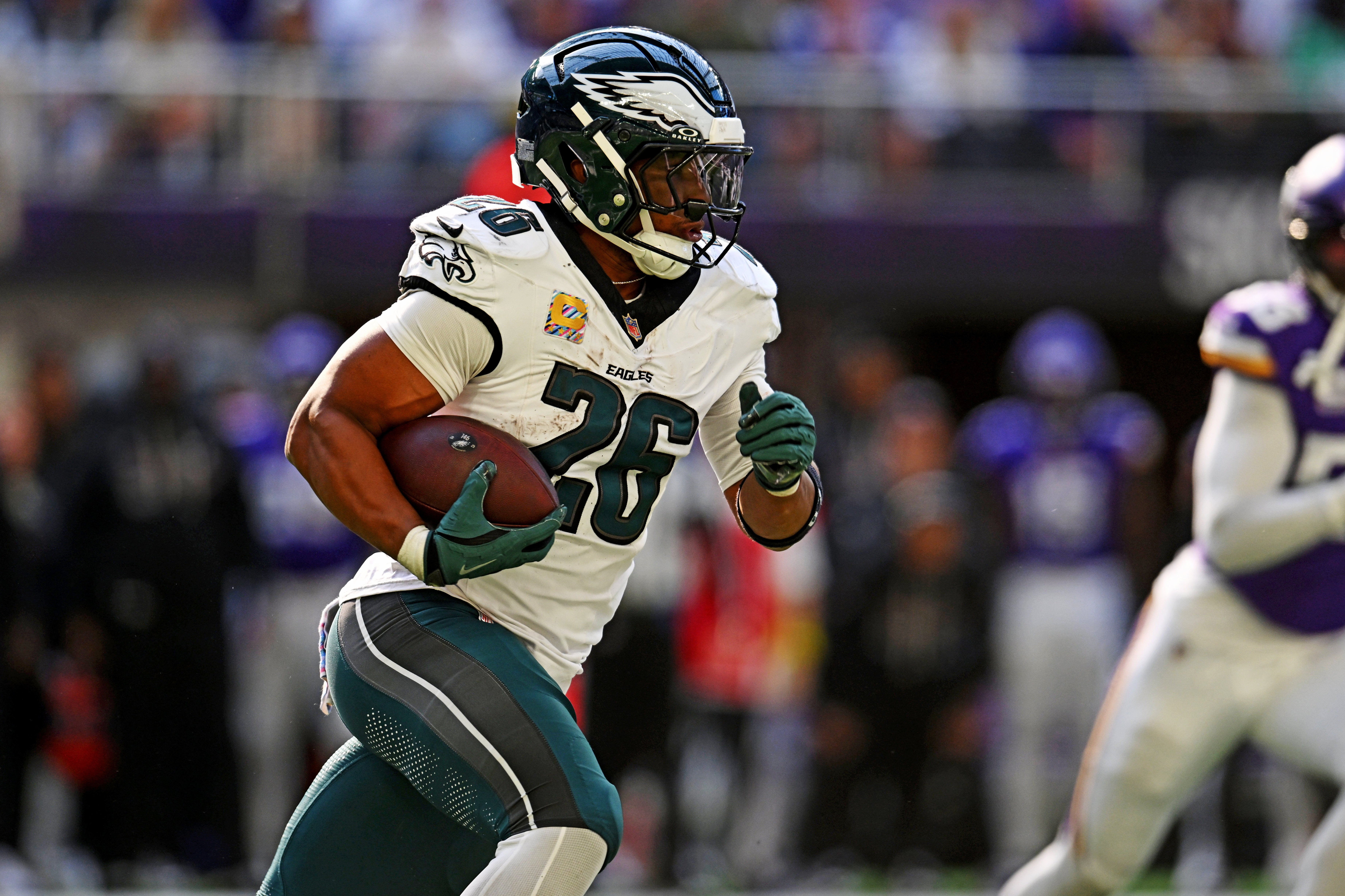 hiladelphia Eagles running back Saquon Barkley (26) runs the ball during the second half against the Minnesota Vikings at U.S. Bank Stadium.