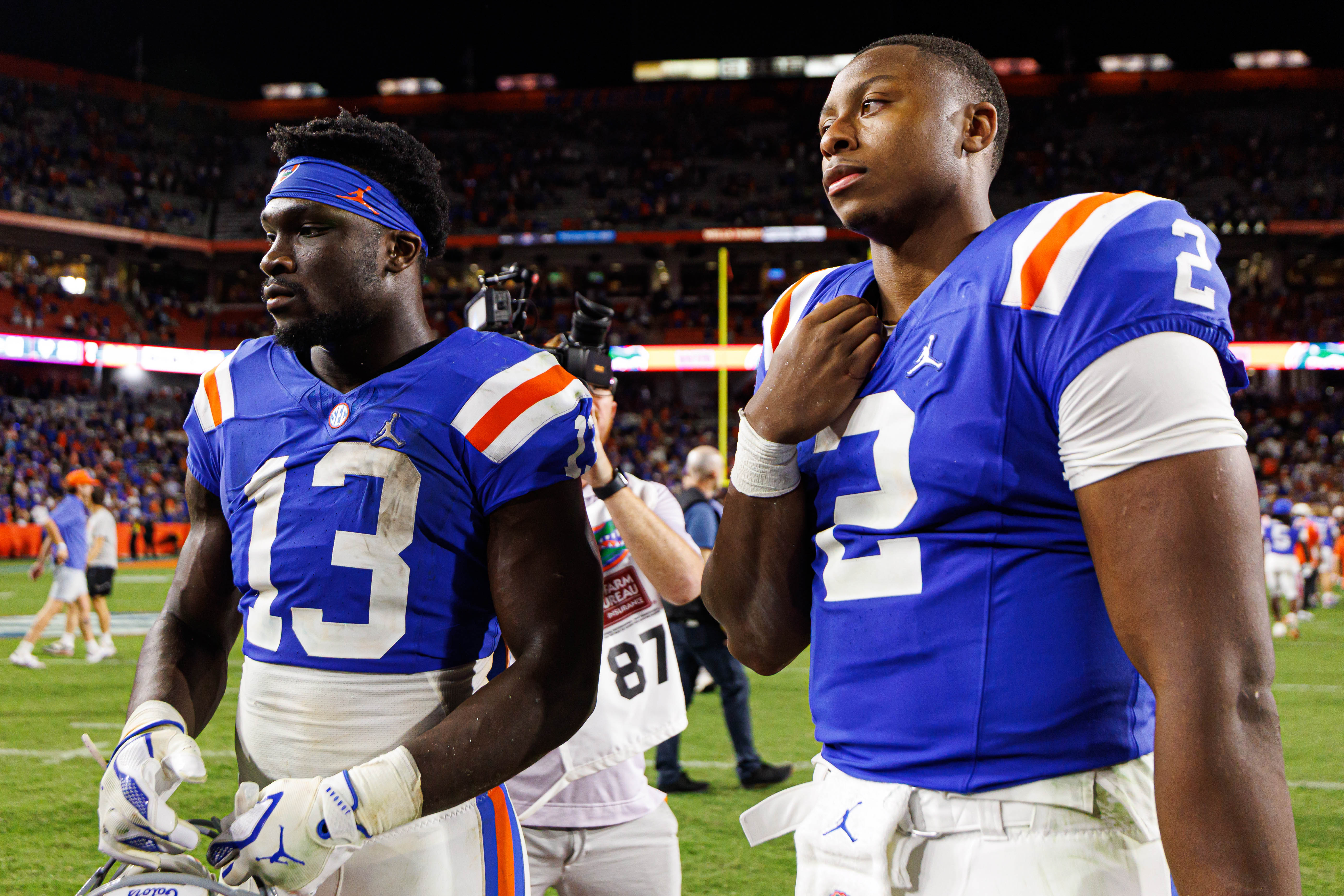 Oct 18, 2025; Gainesville, Florida, USA; Florida Gators running back Jadan Baugh (13) and Florida Gators quarterback DJ Lagway (2) wait on the field after a game against the Mississippi State Bulldogs at Ben Hill Griffin Stadium.
