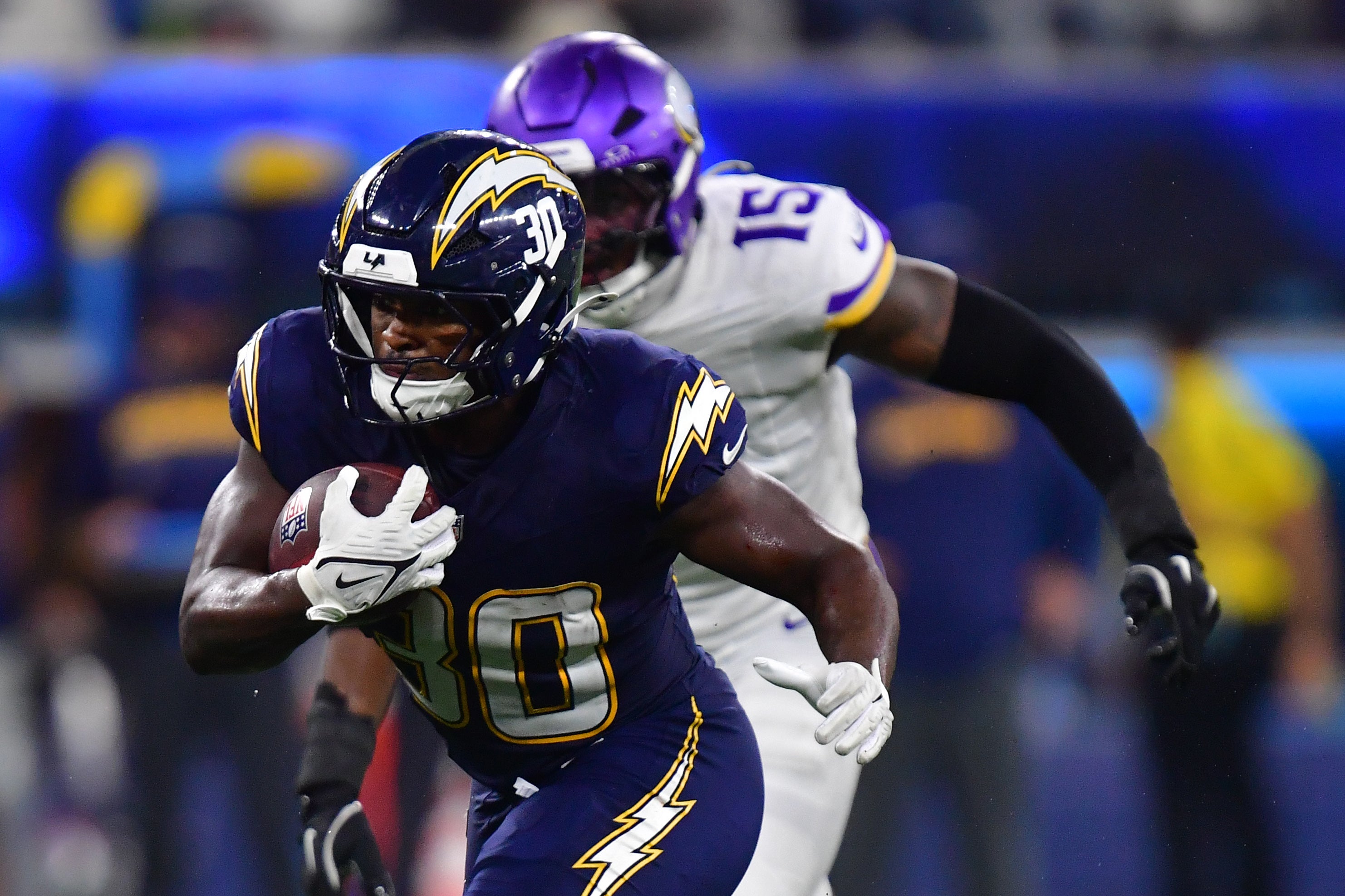 Oct 23, 2025; Inglewood, California, USA; Los Angeles Chargers running back Kimani Vidal (30) rushes the ball against the Minnesota Vikings during the second half at SoFi Stadium. Mandatory Credit: Gary A. Vasquez-Imagn Images