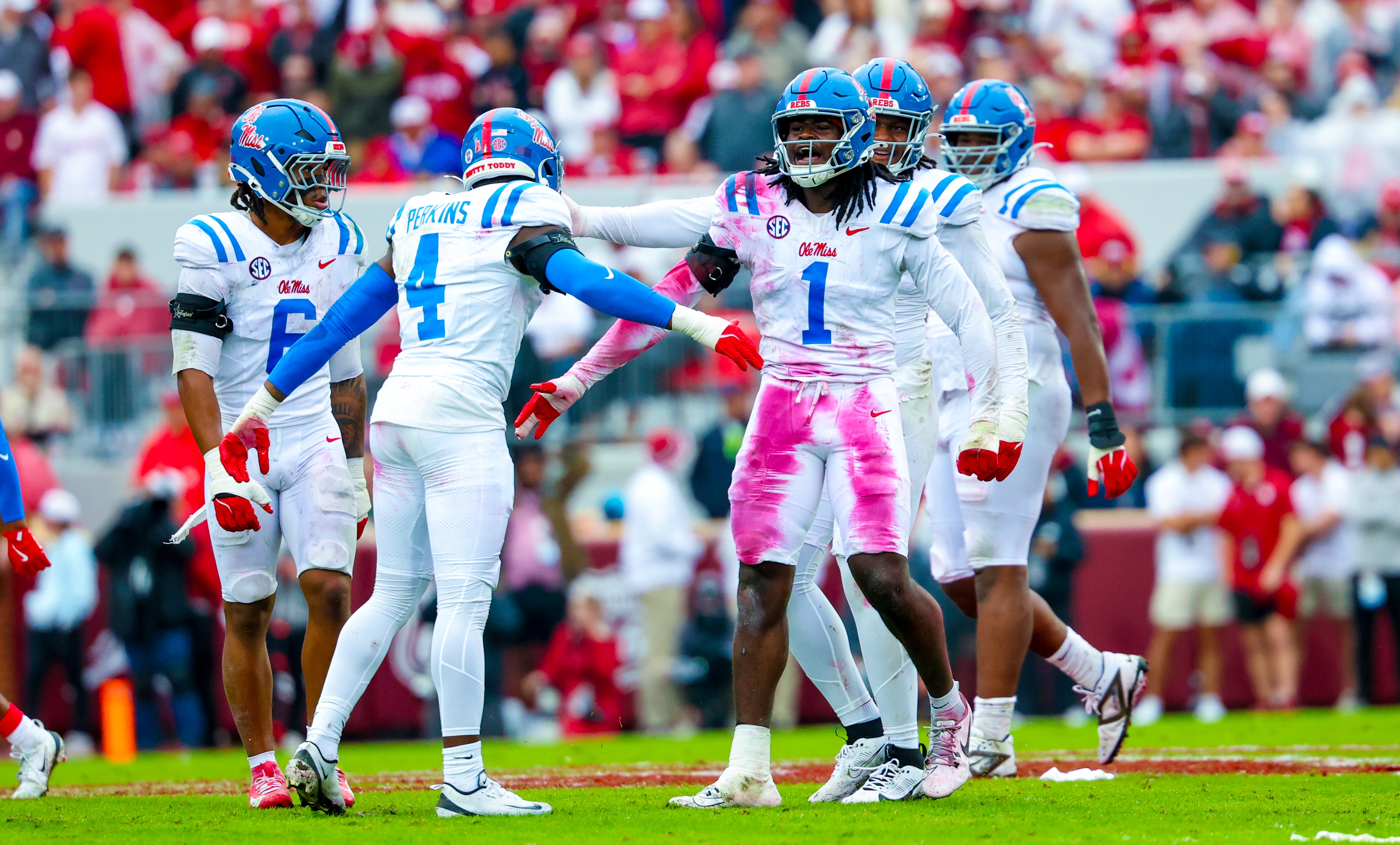 Oct 25, 2025; Norman, Oklahoma, USA; Ole Miss Rebels defensive end Princewill Umanmielen (1) celebrates with Ole Miss Rebels linebacker Suntarine Perkins (4) during the first half at Gaylord Family-Oklahoma Memorial Stadium. Mandatory Credit: Kevin Jairaj-Imagn Images