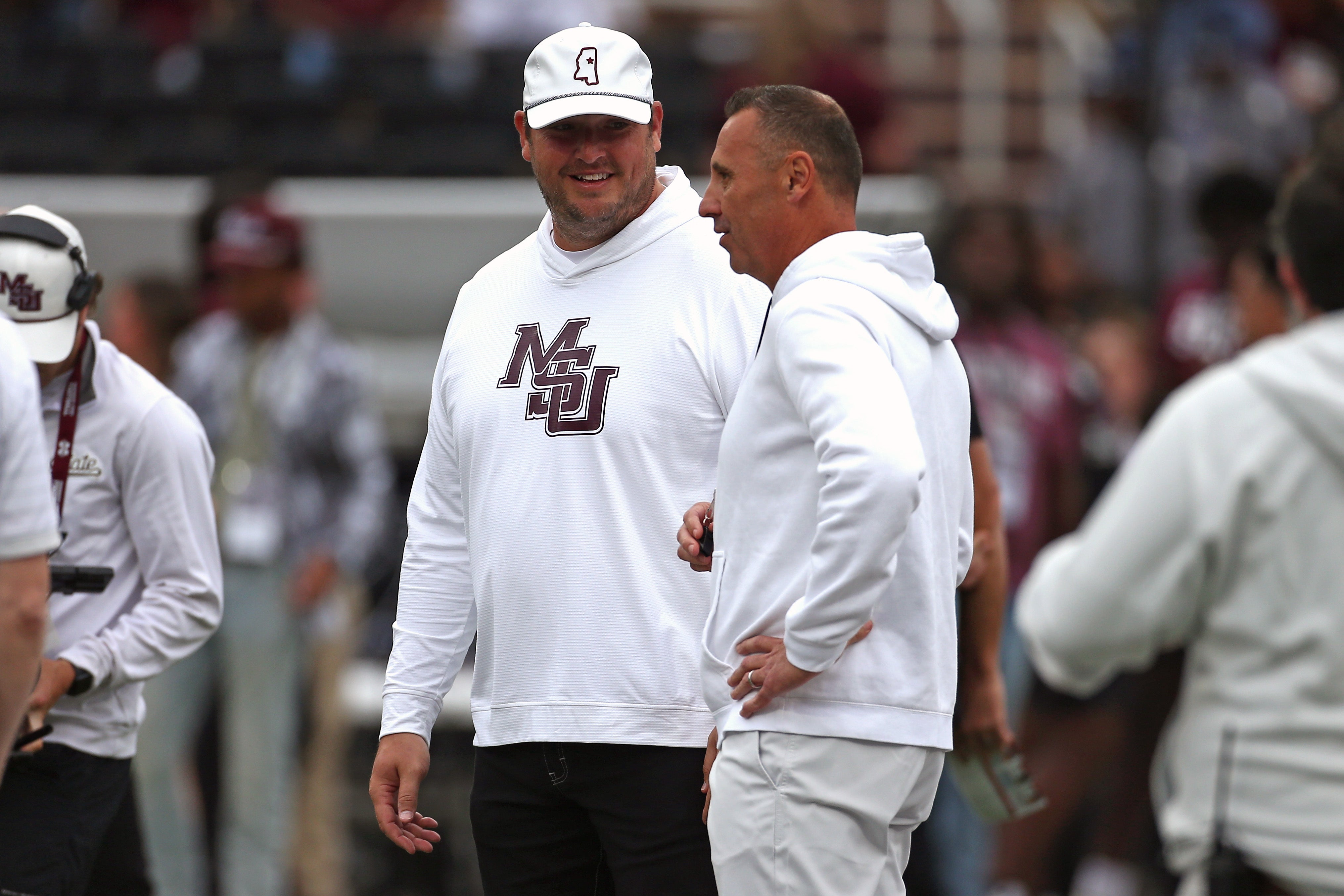 Oct 25, 2025; Starkville, Mississippi, USA; Mississippi State Bulldogs head coach Jeff Lebby and Texas Longhorns head coach Steve Sarkisian talk prior to the game at Davis Wade Stadium at Scott Field. Mandatory Credit: Petre Thomas-Imagn Images
