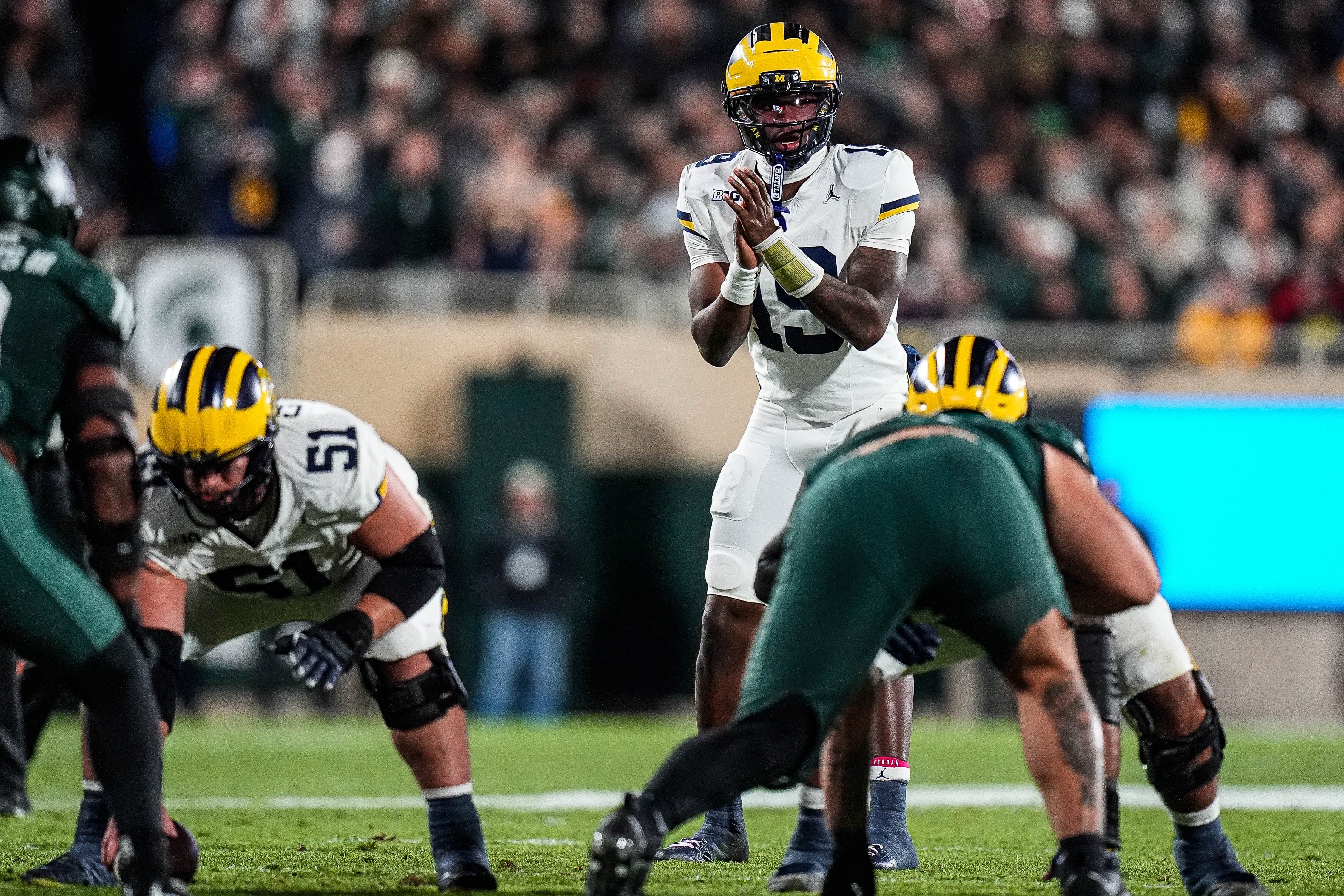 Michigan quarterback Bryce Underwood (19) calls for a snap against Michigan State during the first half at Spartan Stadium in East Lansing on Saturday, October 25, 2025.