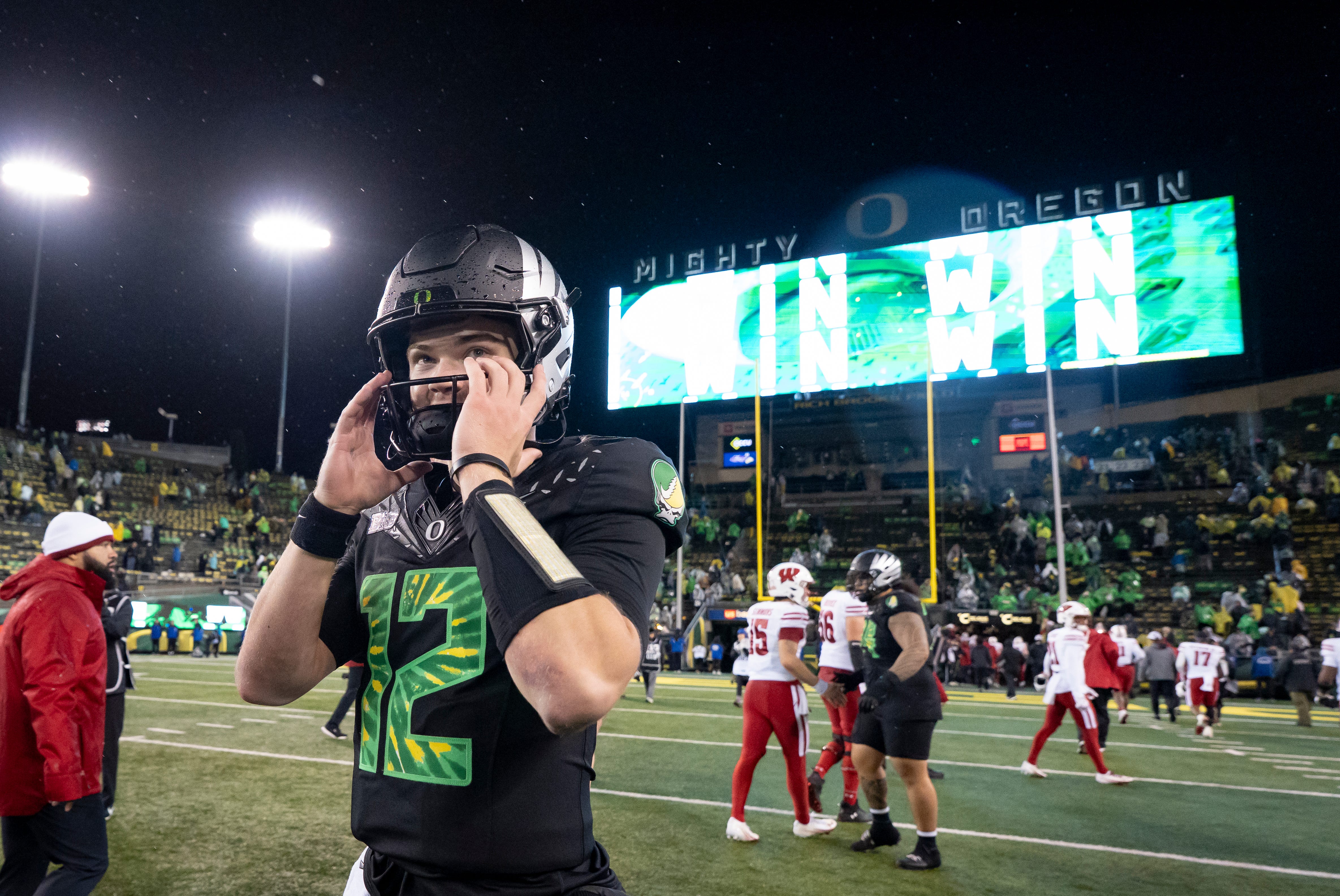 Oregon quarterback Brock Thomas walks off after a win as the Oregon Ducks host the Wisconsin Badgers on Oct. 25, 2025, at Autzen Stadium in Eugene, Oregon.