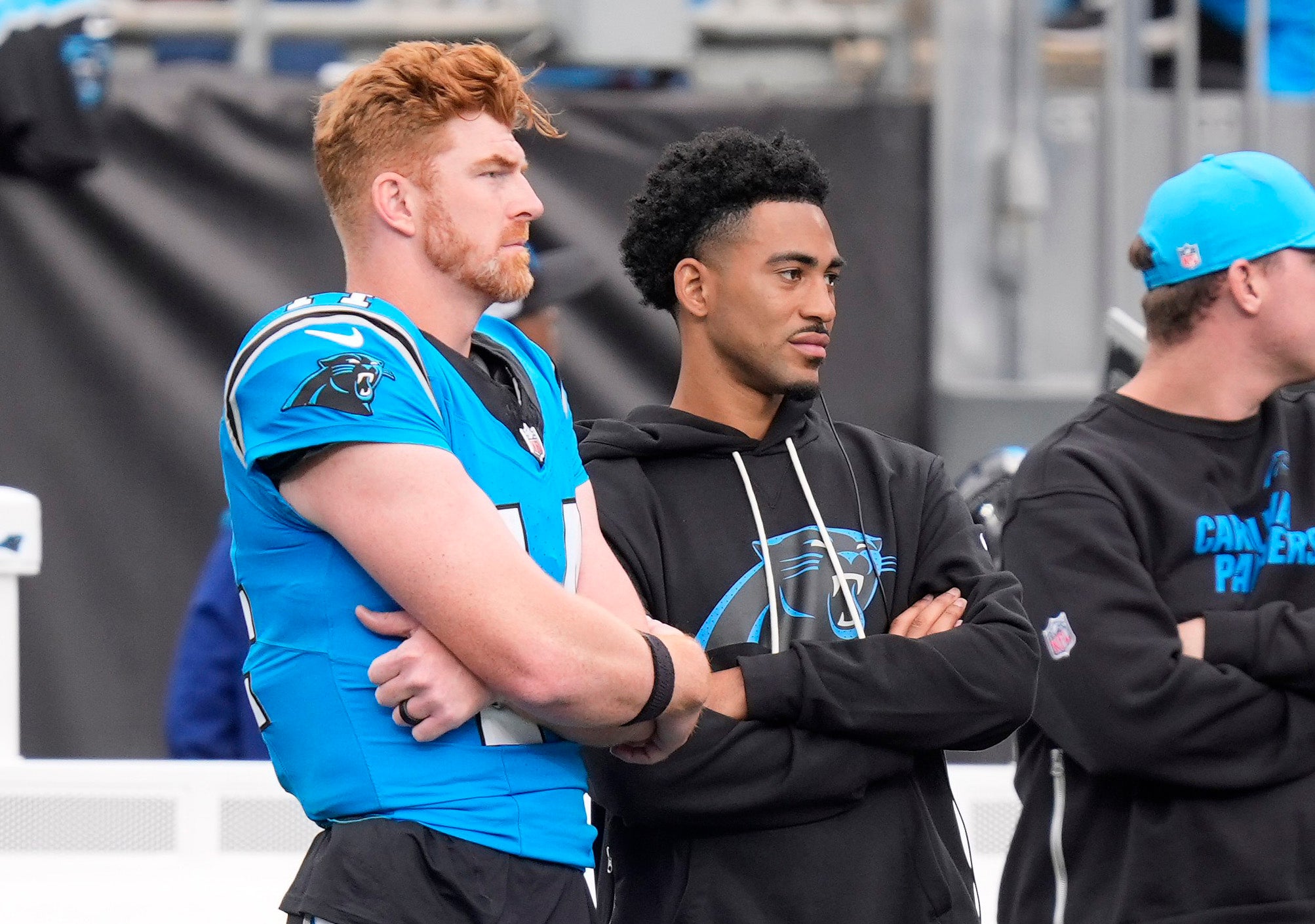 Oct 26, 2025; Charlotte, North Carolina, USA; Carolina Panthers quarterbacks Andy Dalton (14) and Bryce Young (9) on the sideline during the second half against the Buffalo Bills at Bank of America Stadium.