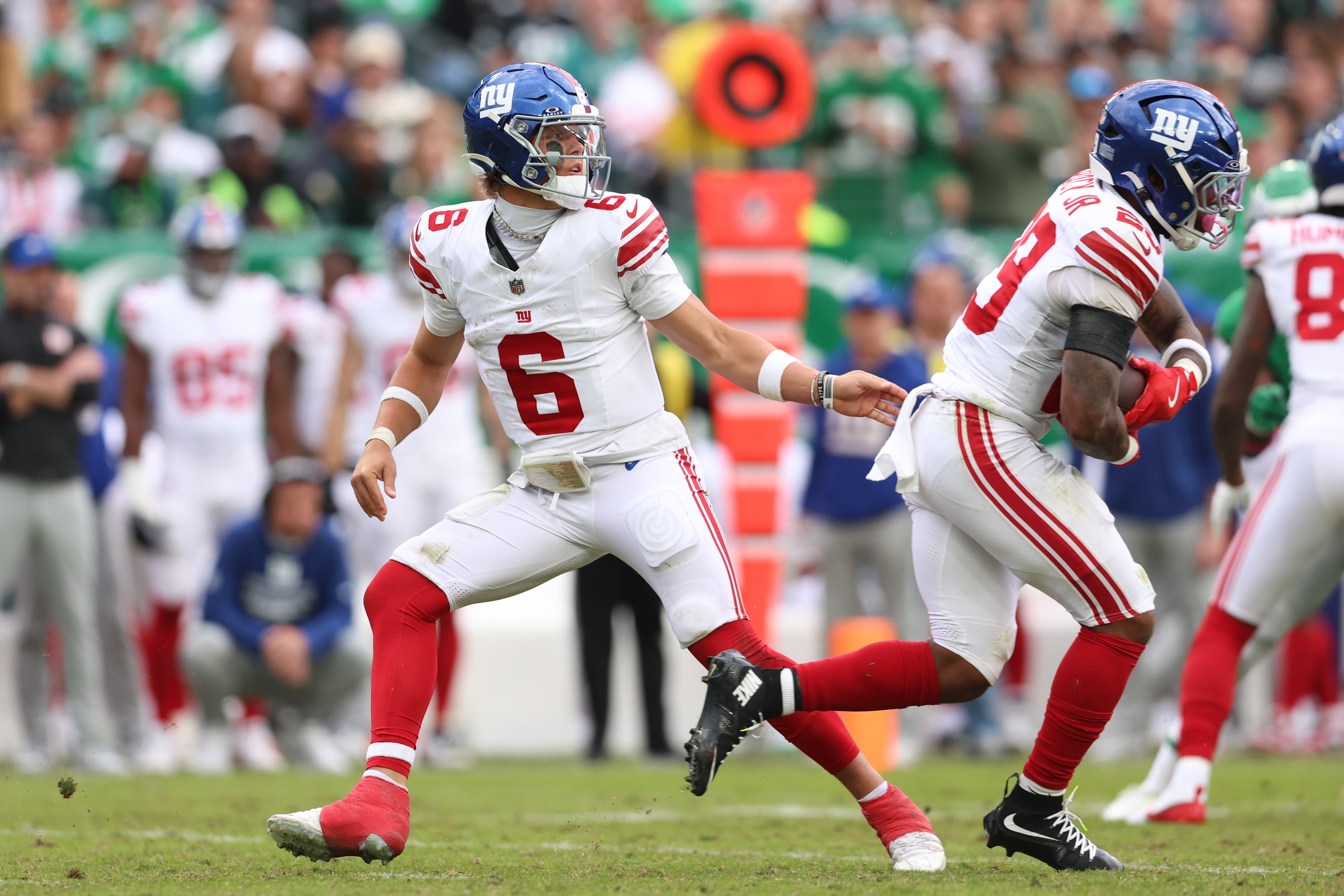 Oct 26, 2025; Philadelphia, Pennsylvania, USA; New York Giants quarterback Jaxson Dart (6) hands off to New York Giants running back Tyrone Tracy Jr. (29) during the third quarter against the Philadelphia Eagles at Lincoln Financial Field.