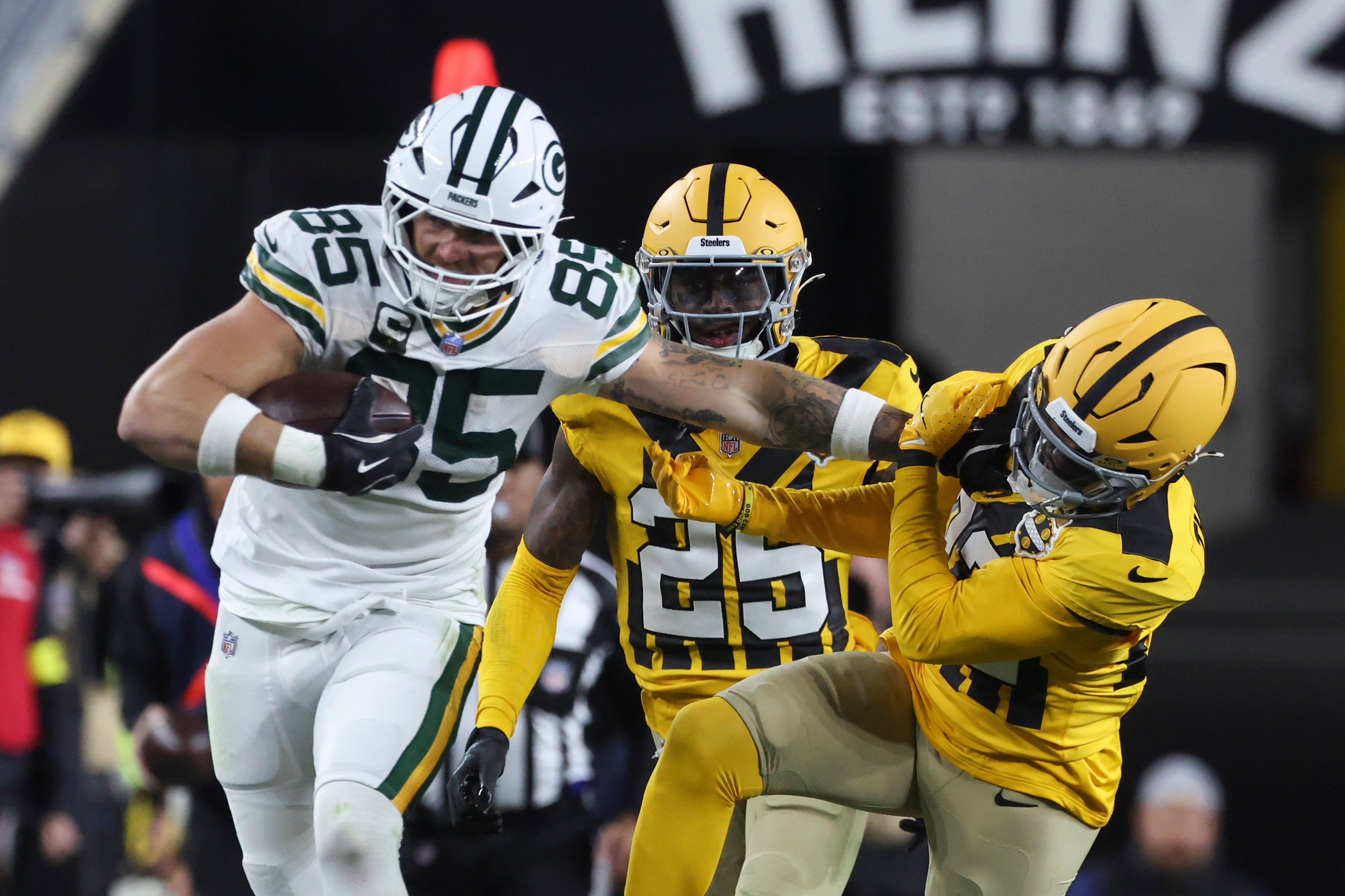 Oct 26, 2025; Pittsburgh, Pennsylvania, USA; Green Bay Packers tight end Tucker Kraft (85) stiff arms Pittsburgh Steelers safety Juan Thornhill (22) during the third quarter at Acrisure Stadium.