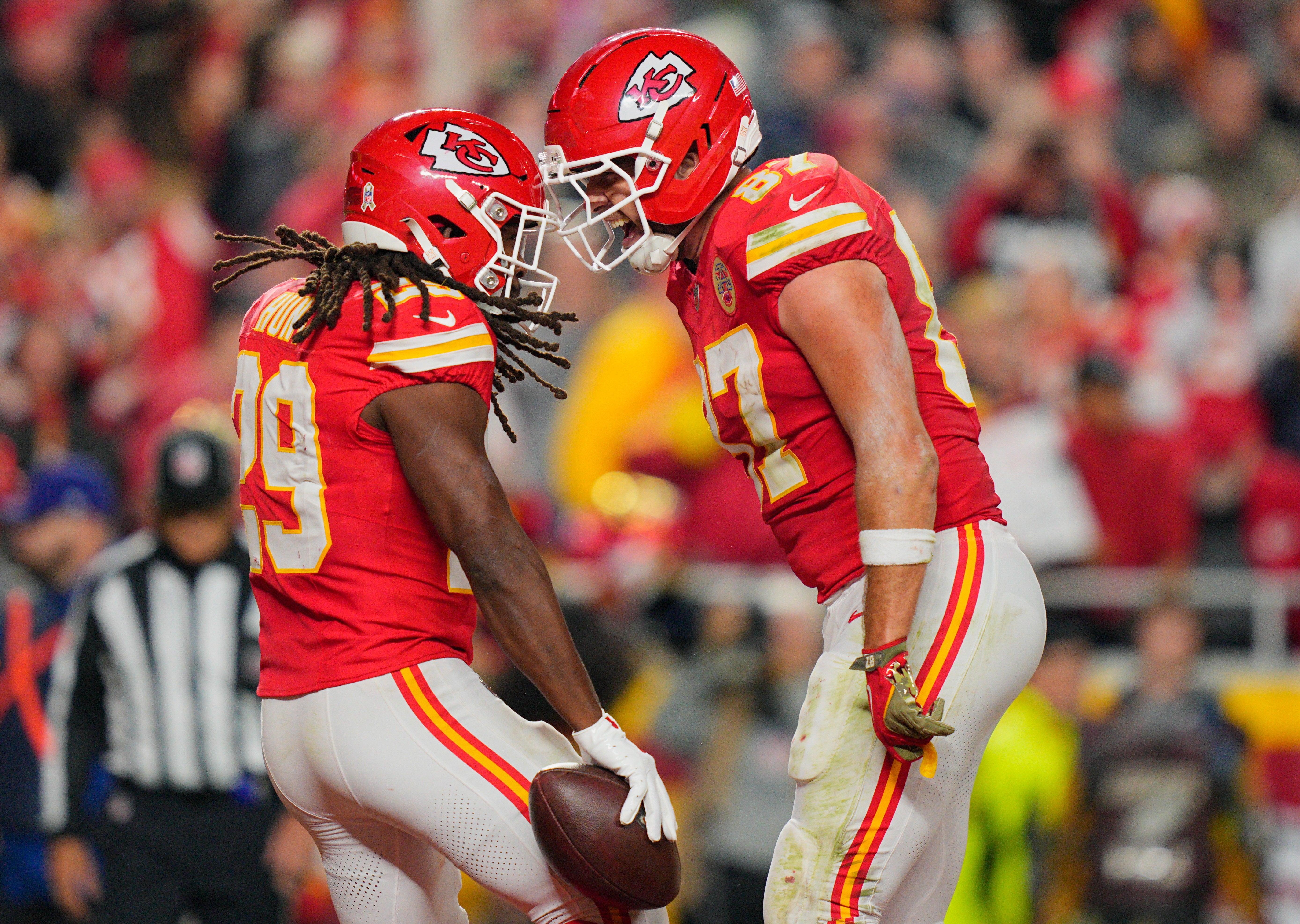 Kansas City Chiefs running back Kareem Hunt (29) celebrates after scoring a touchdown against the Washington Commanders with tight end Travis Kelce (87)