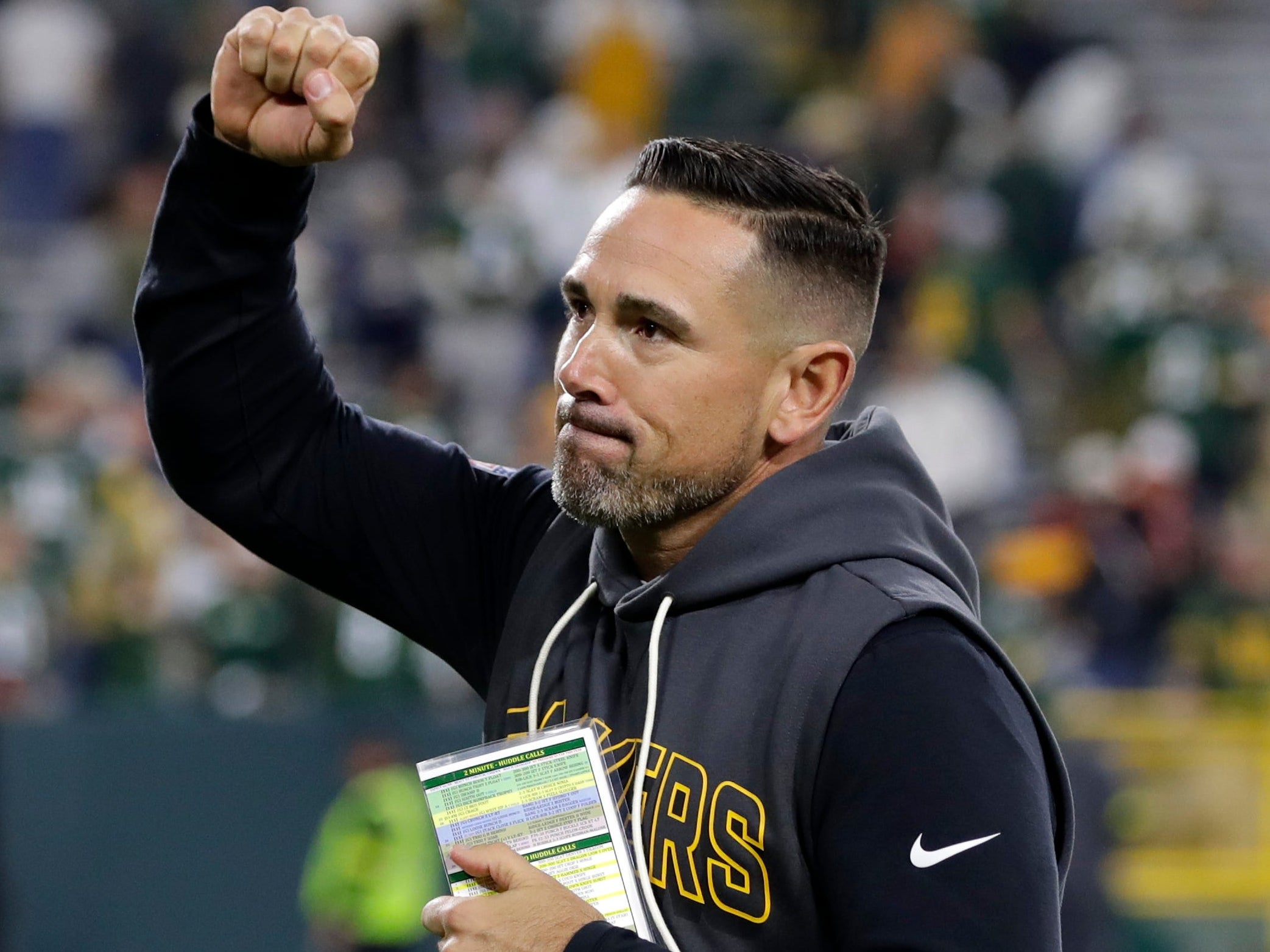 Green Bay Packers head coach Matt LaFleur acknowledges fans as he runs off the field following the team's win over the Cincinnati Bengals on Oct. 12, 2025, at Lambeau Field in Green Bay, Wis. The Packers defeated the Bengals 27-18.