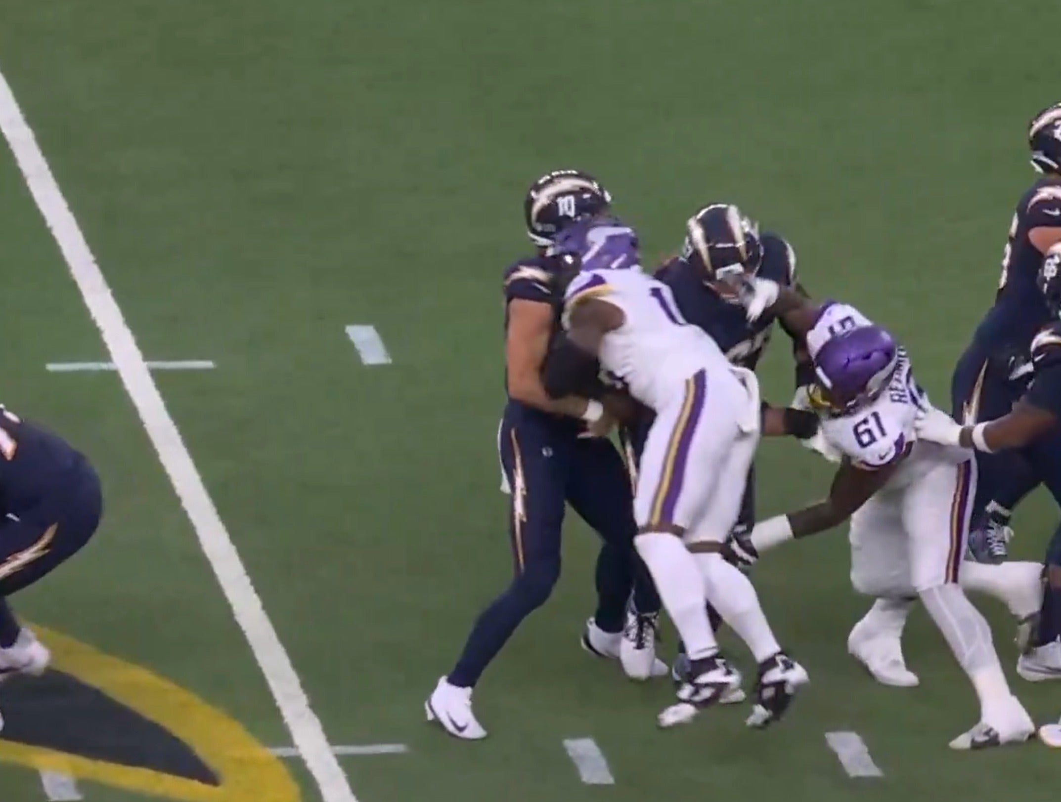 Minnesota Vikings edge rusher Dallas Turner launches himself head first at Los Angeles Chargers quarterback Justin Herbert. He was assessed a roughing the passer penalty and fined for the hit.