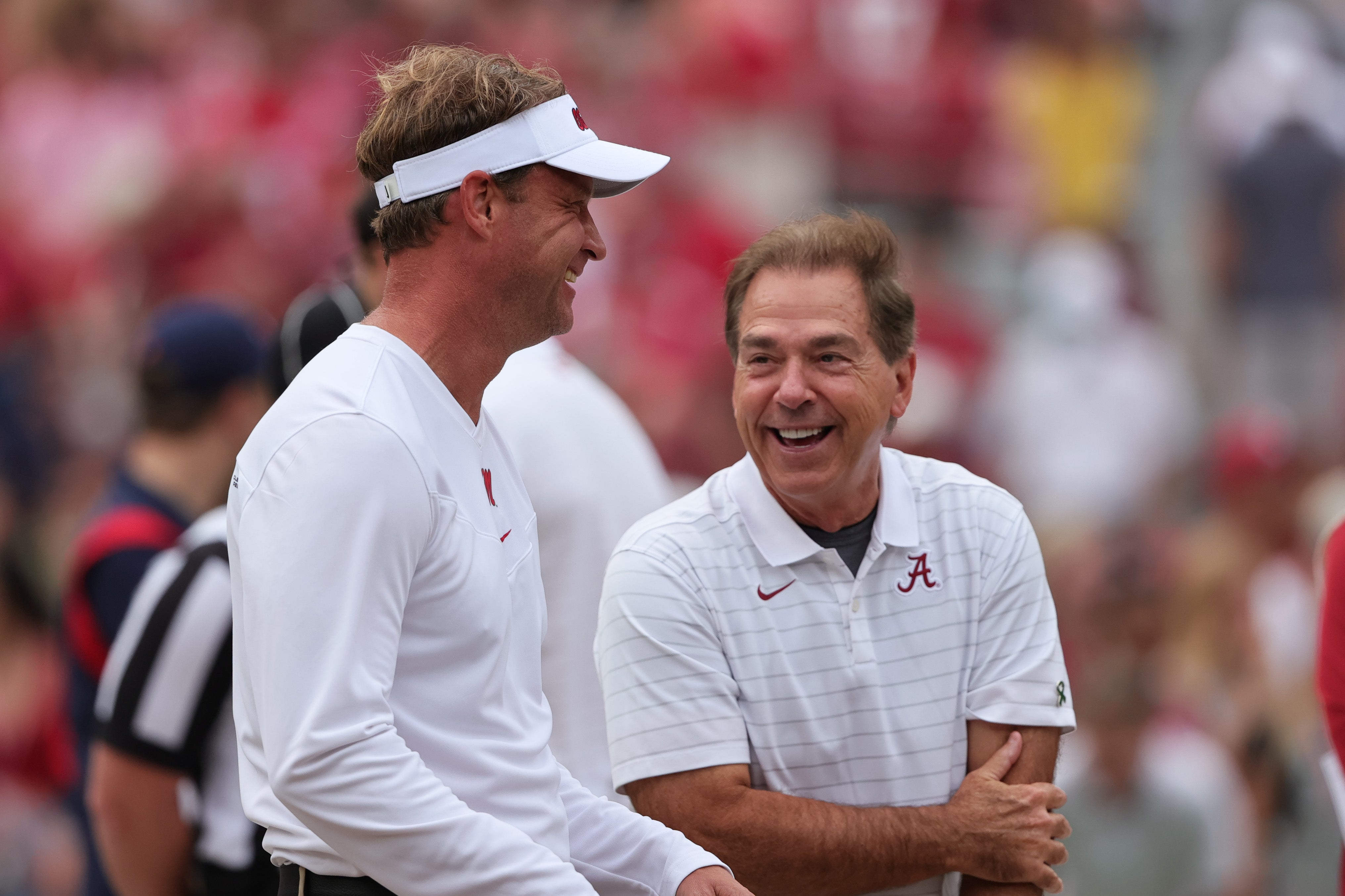 Oct 2, 2021; Tuscaloosa, Alabama, USA; Mississippi Rebels head coach Lane Kiffin talks with Alabama Crimson Tide head coach Nick Saban before the start of an NCAA college football game at Bryant-Denny Stadium.