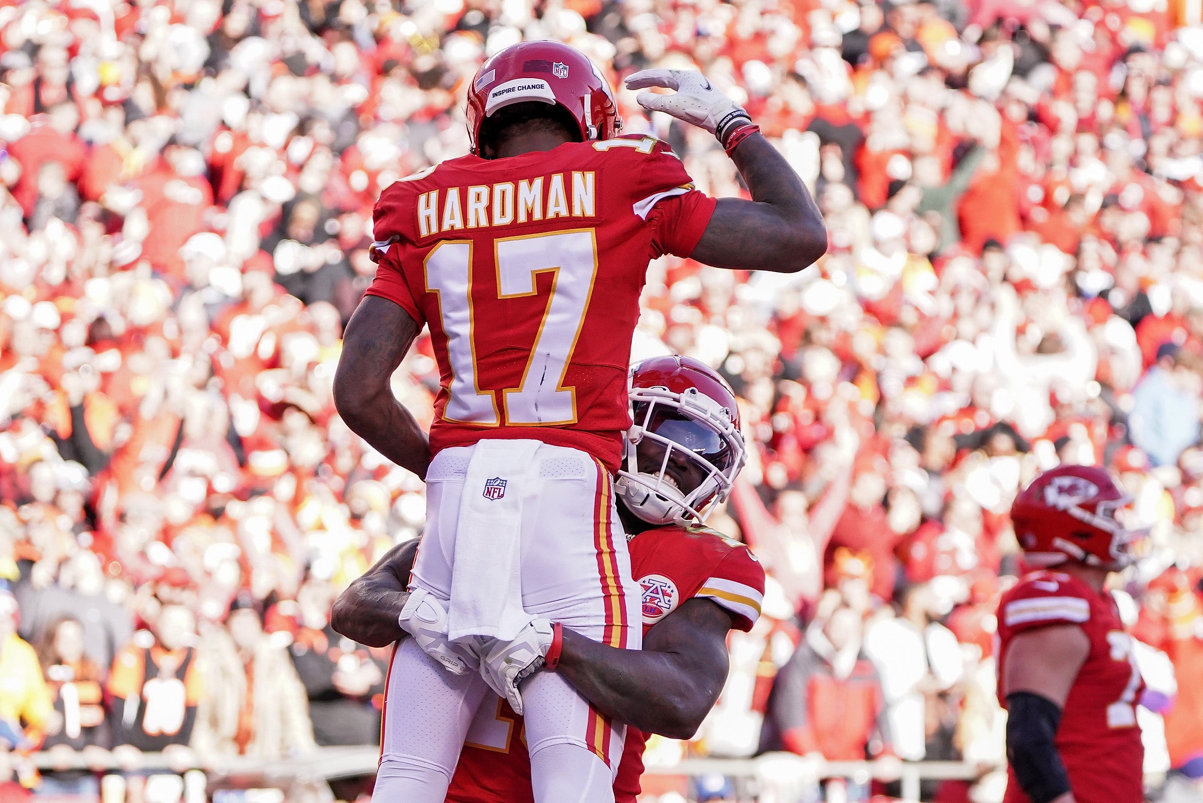 Jan 30, 2022; Kansas City, Missouri, USA; Kansas City Chiefs wide receiver Tyreek Hill (10) lifts up wide receiver Mecole Hardman (17) as they celebrate a touchdown against the Cincinnati Bengals during the second quarter of the AFC Championship Game at GEHA Field at Arrowhead Stadium.