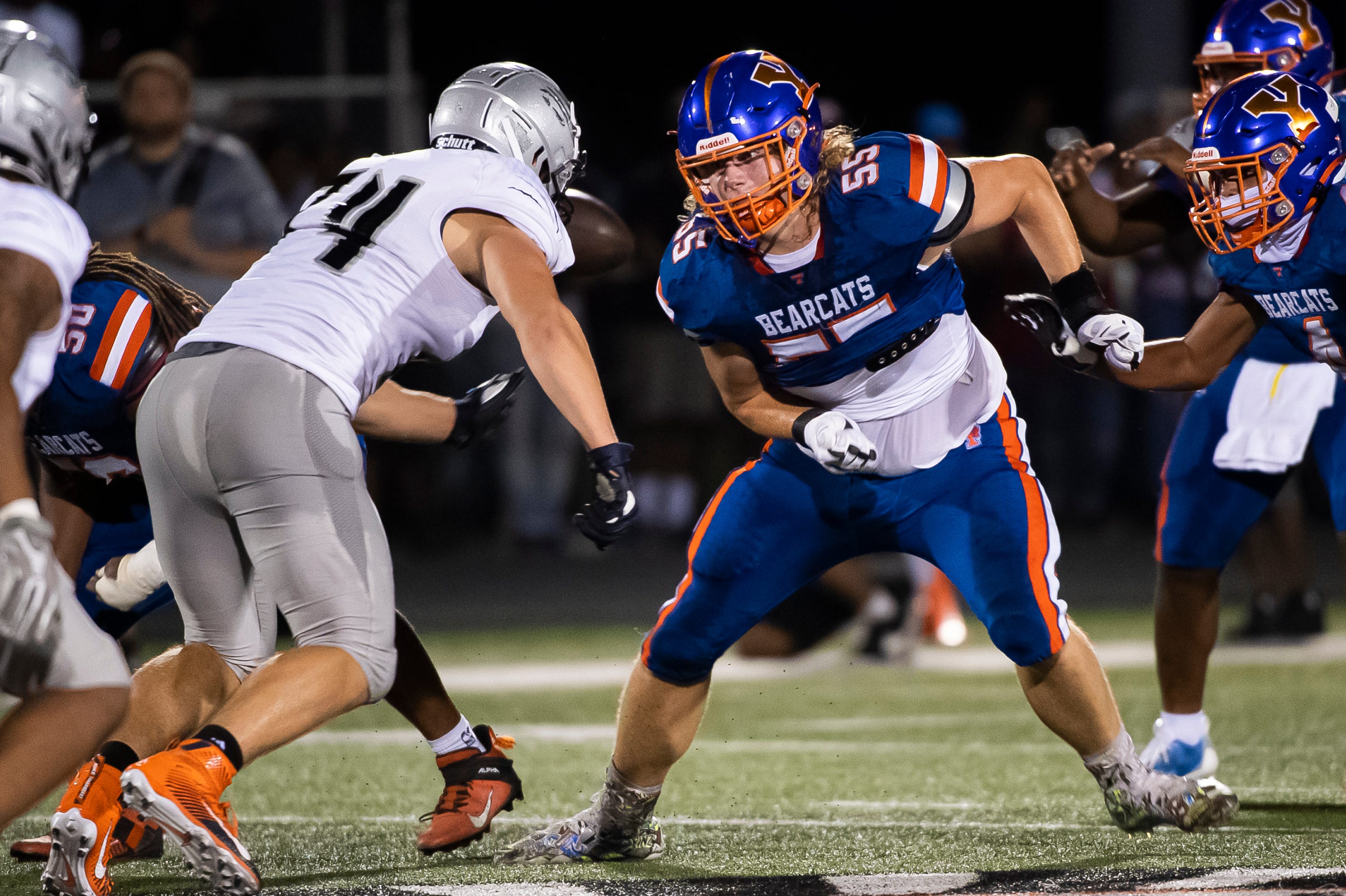 York High offensive lineman Michael McMonigle (55) goes up against Harrisburg's Kevin Brown (74) in the trenches during the York Rose Bowl Kickoff Classic at York Suburban High School on August 26, 2023.