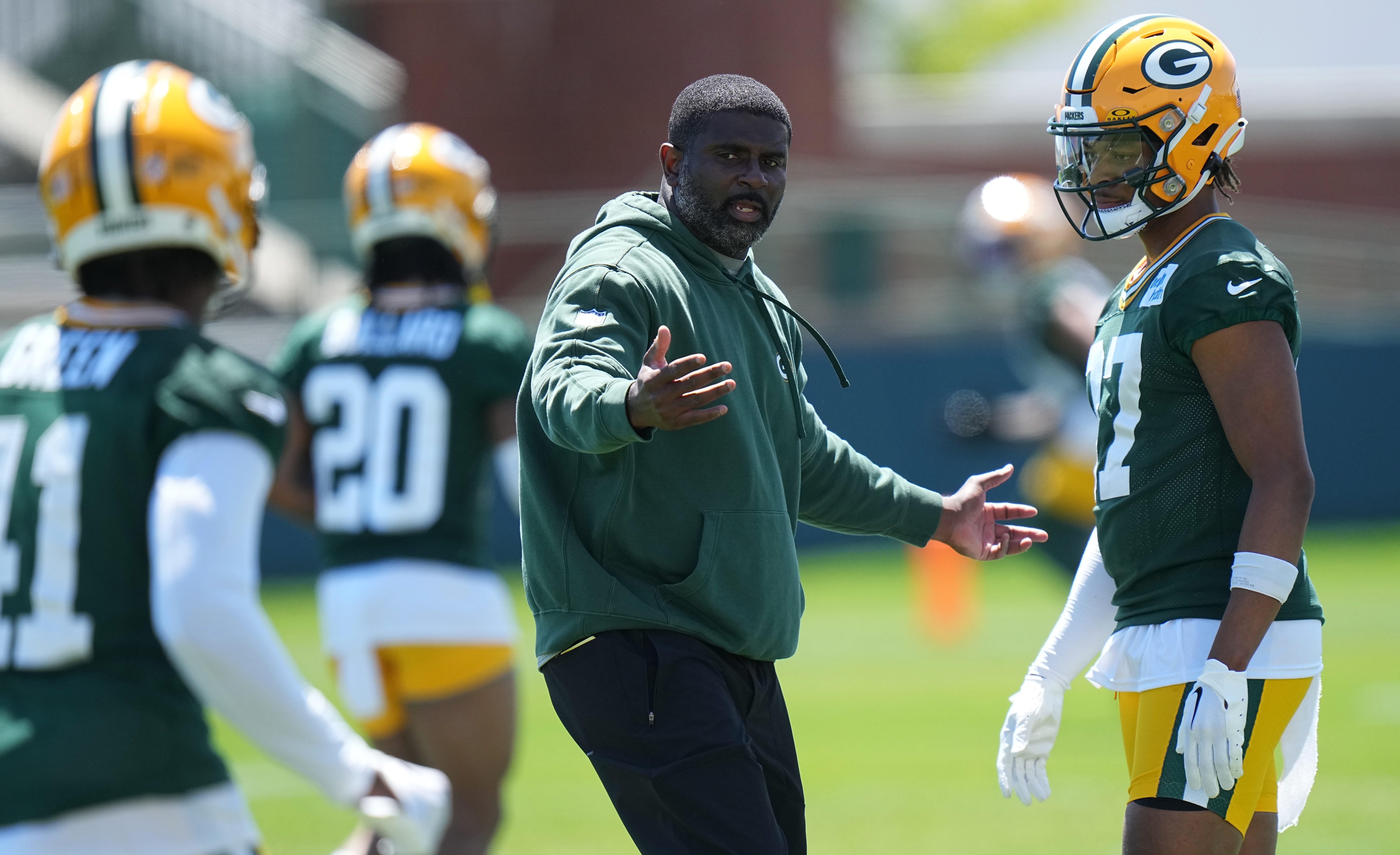 Green Bay Packers cornerback Carrington Valentine (37) listens to defensive passing coordinator Derrick Ansley during organized team activities Wednesday, May 29, 2024 in Green Bay, Wisconsin.