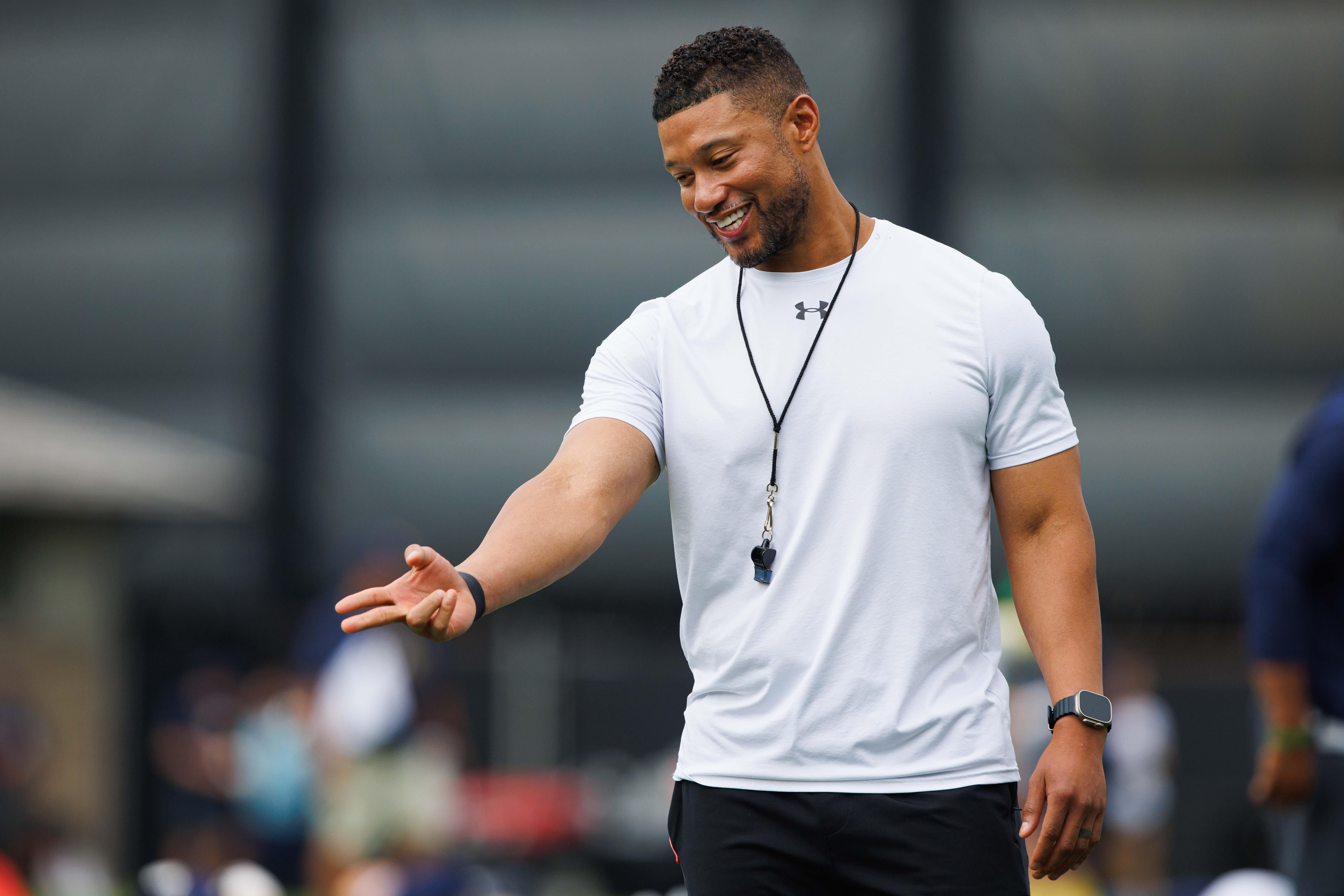 Notre Dame head coach Marcus Freeman greets players during a Notre Dame football practice at Irish Athletic Center on Tuesday, Aug. 6, 2024, in South Bend.