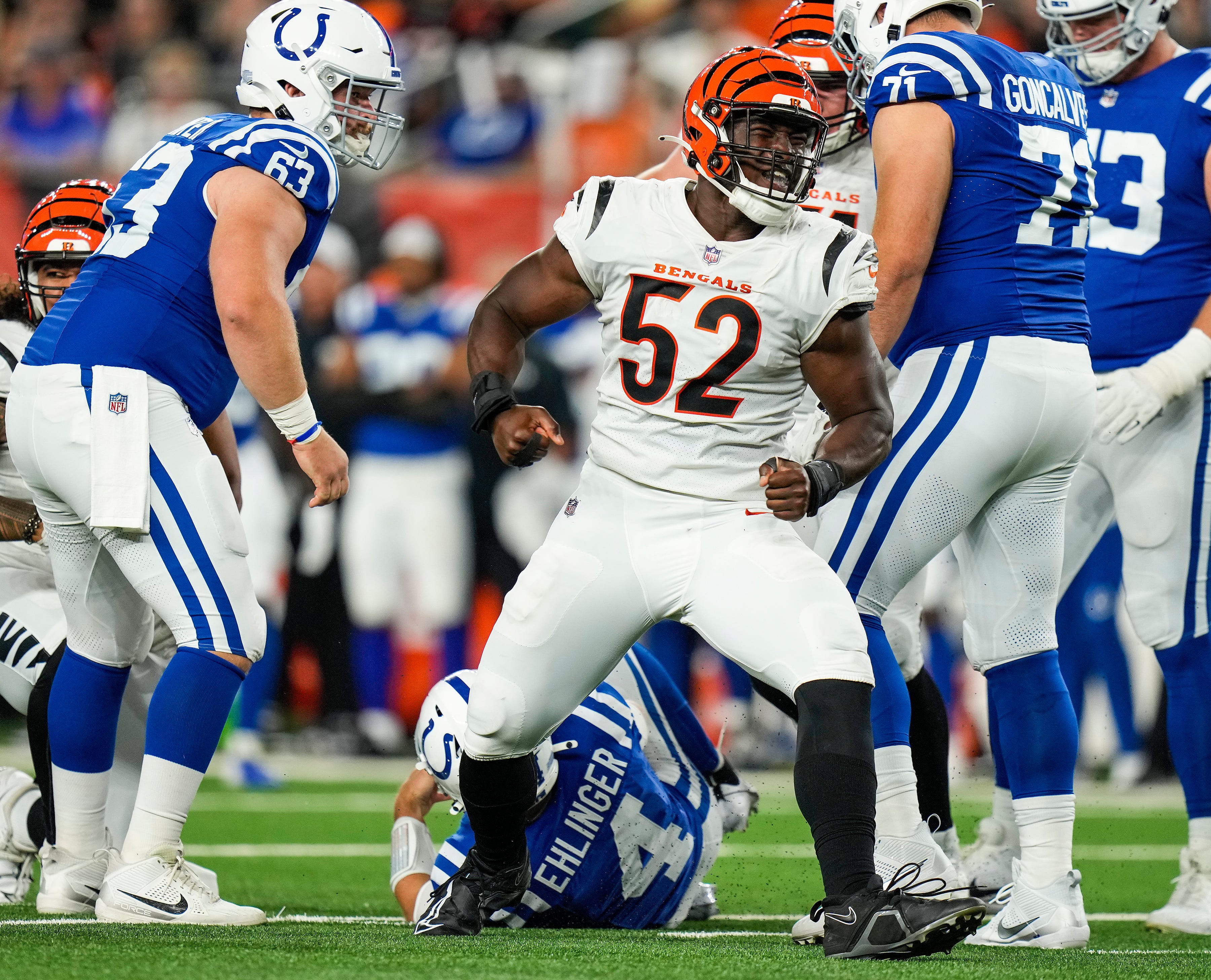 Cincinnati Bengals defensive end Cedric Johnson (52) celebrates taking down Indianapolis Colts quarterback Sam Ehlinger (4) in the second quarter of the NFL preseason game at Paycor Stadium in Cincinnati on Thursday, Aug. 22, 2024.