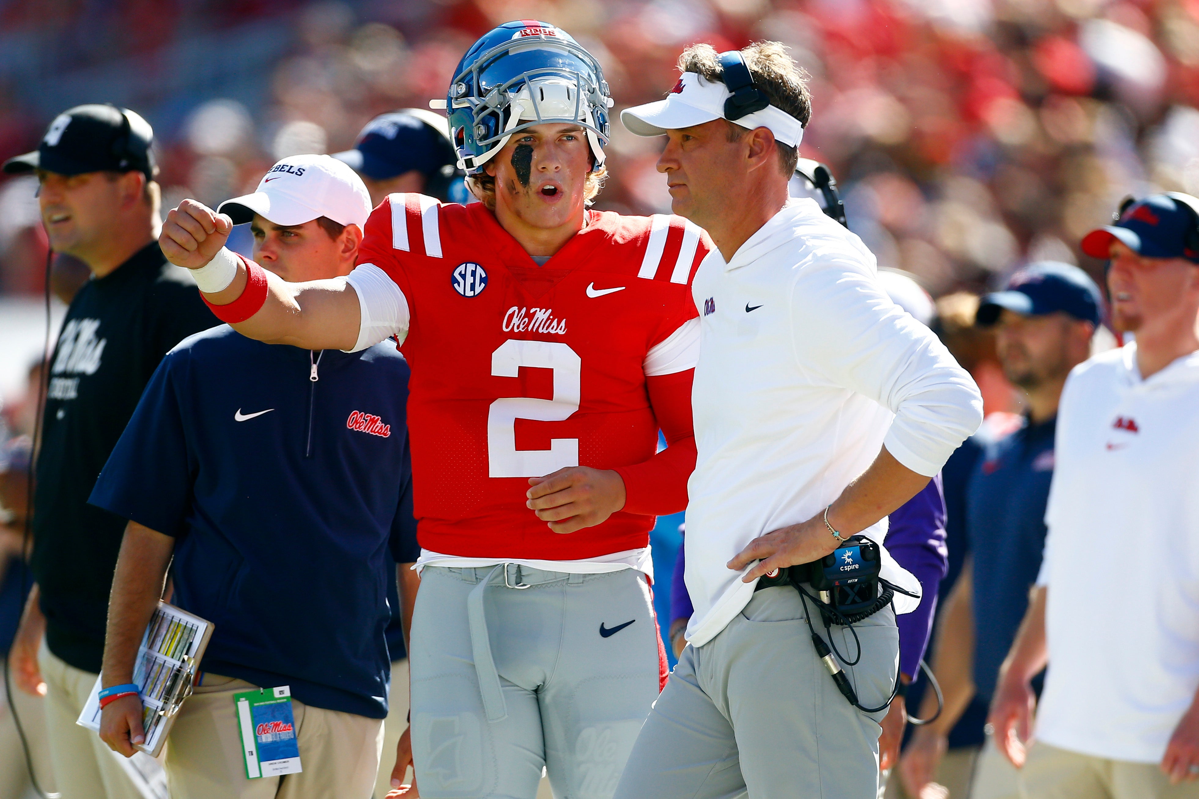 Sep 7, 2024; Oxford, Mississippi, USA; Mississippi Rebels quarterback Jaxson Dart (2) talks with Mississippi Rebels head coach Lane Kiffin during the first half against the Middle Tennessee Blue Raiders at Vaught-Hemingway Stadium.
