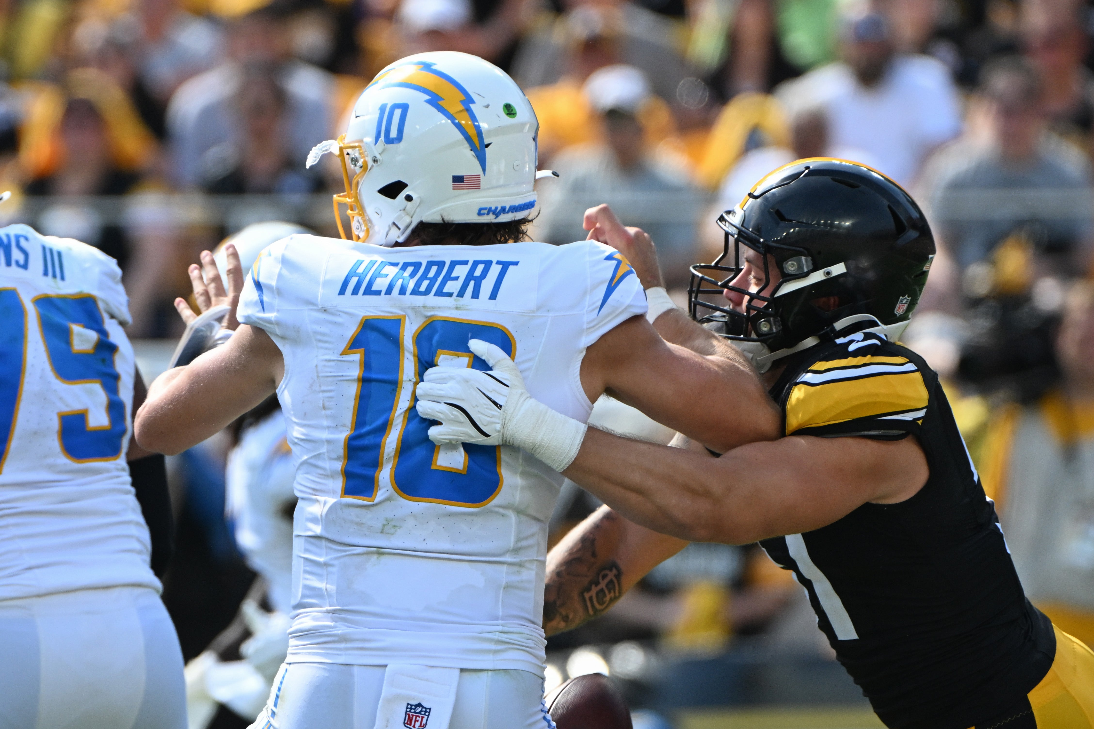 Sep 22, 2024; Pittsburgh, Pennsylvania, USA; Pittsburgh Steelers linebacker Nick Herbig (51) sacks Los Angeles Chargers quarterback Justin Herbert (10) during the third quarter at Acrisure Stadium.