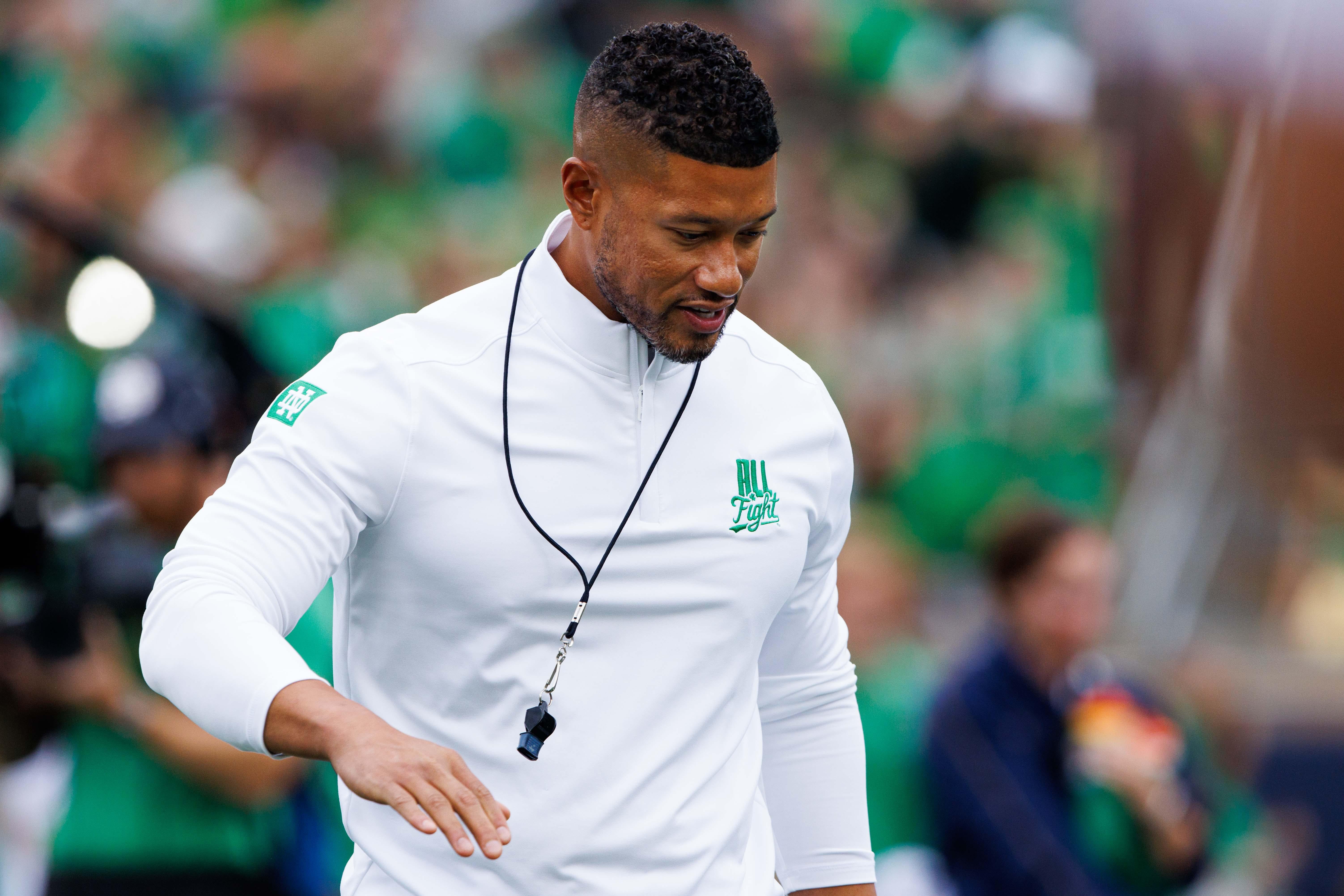 Notre Dame head coach Marcus Freeman greets his players before a NCAA college football game between Notre Dame and Louisville at Notre Dame Stadium on Saturday, Sept. 28, 2024, in South Bend.