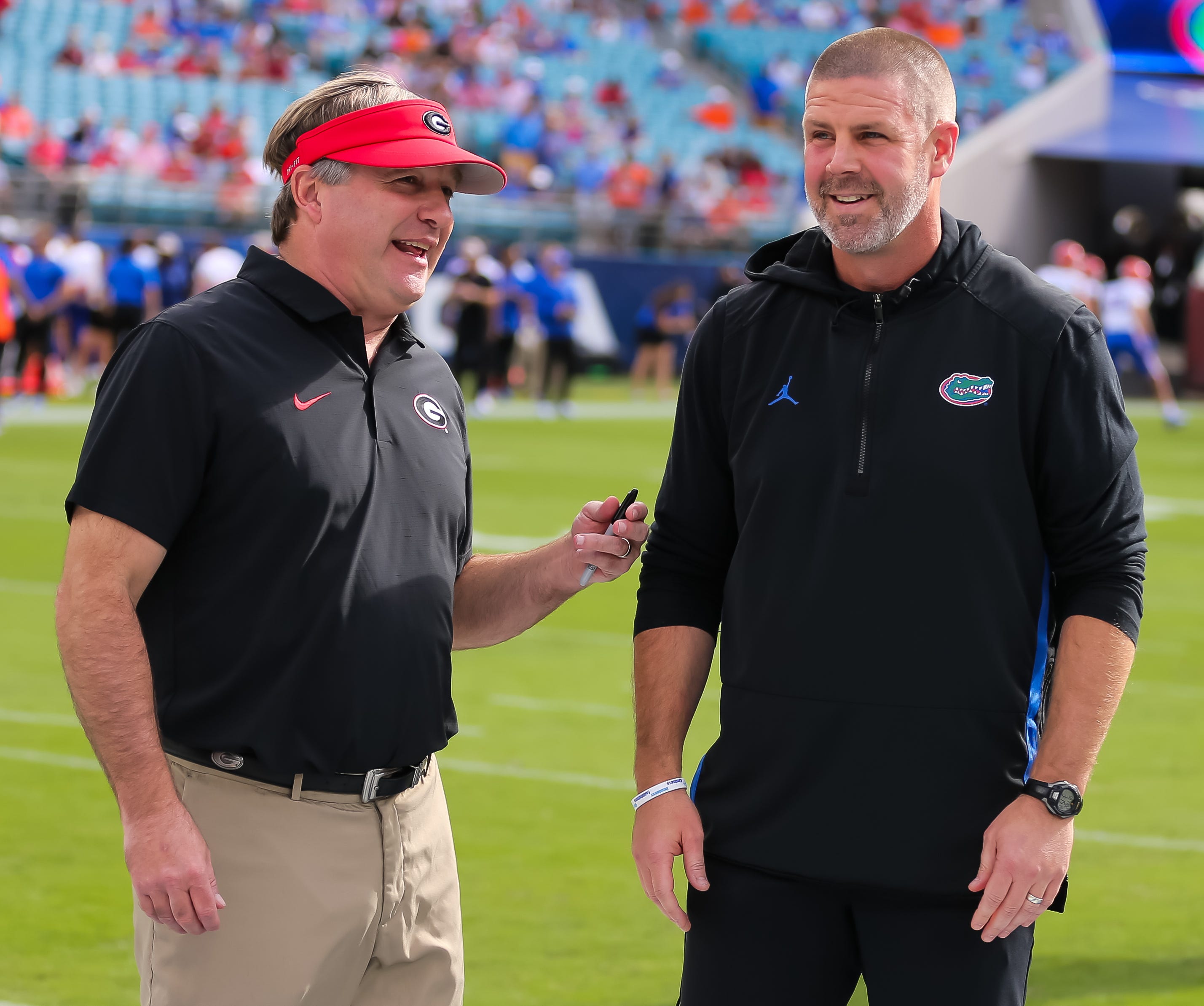 Georgia Bulldogs head coach Kirby Smart and Florida Gators head coach Billy Napier talk before the game before the first half at EverBank Stadium in Jacksonville, FL on Saturday, November 2, 2024.