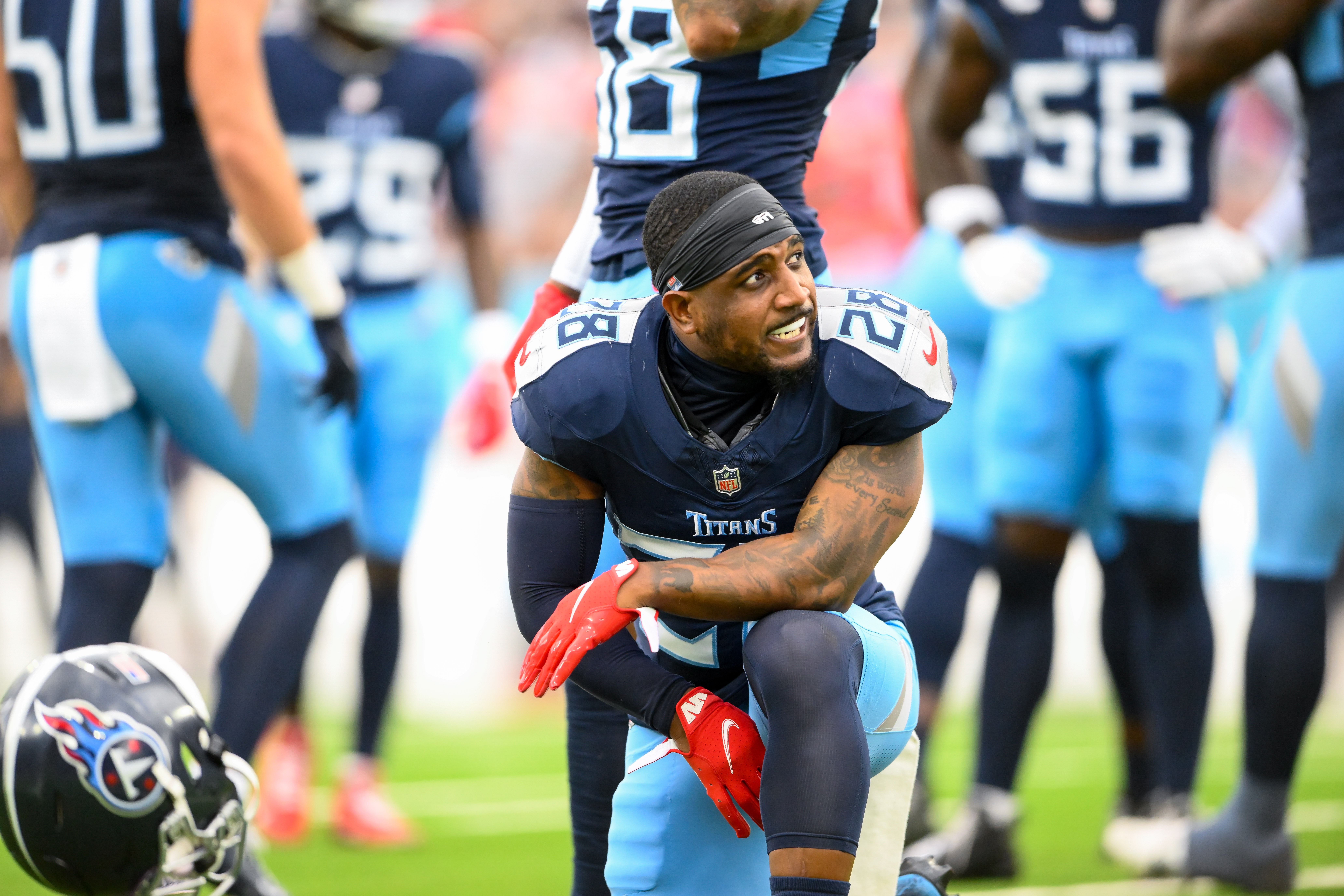 Nov 3, 2024; Nashville, Tennessee, USA; Tennessee Titans safety Quandre Diggs (28) slams his helmet down after an ankle injury against the New England Patriots during the first half at Nissan Stadium.
