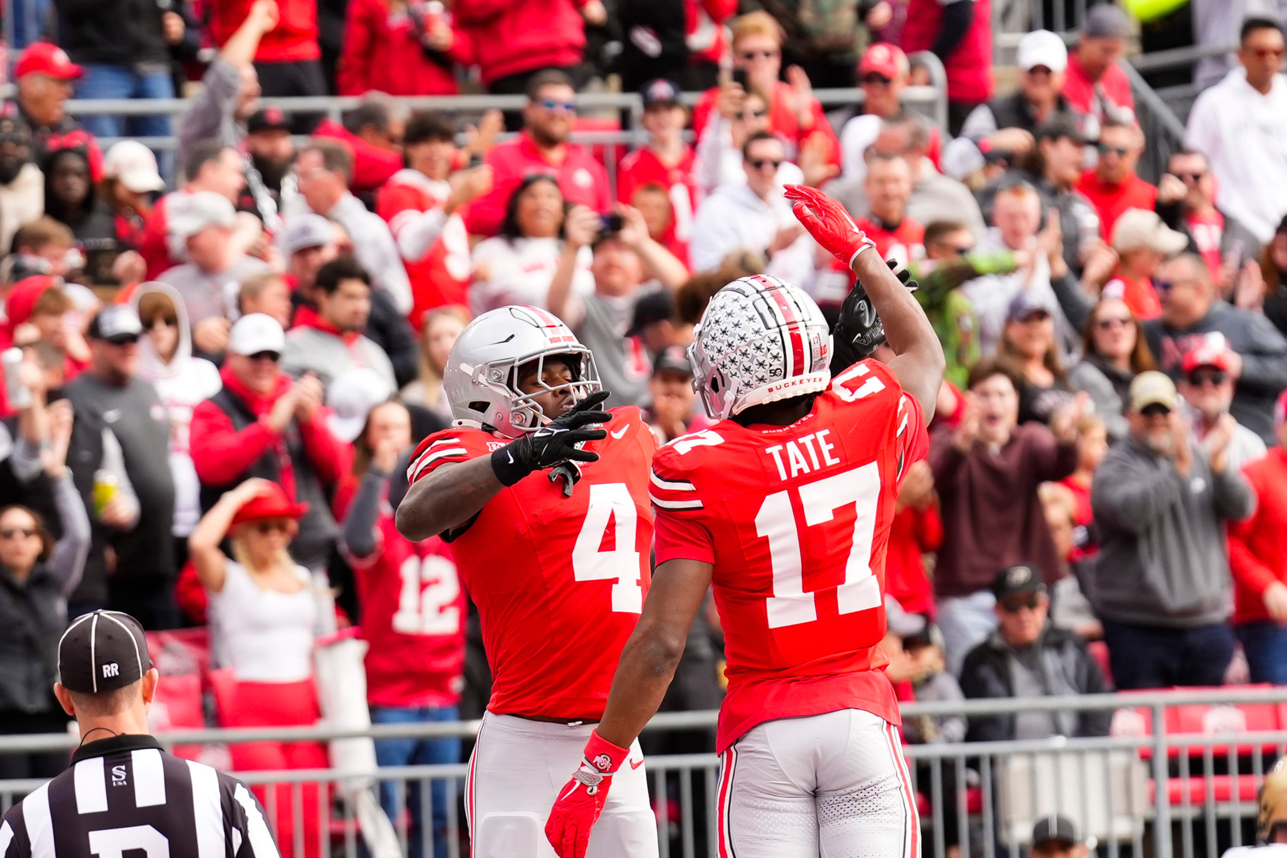 Ohio State Buckeyes wide receiver Jeremiah Smith (4) celebrates with wide receiver Carnell Tate (17) after Smith scored a touchdown in the first half at Ohio Stadium on Saturday, Nov. 9, 2024 in Columbus, Ohio.