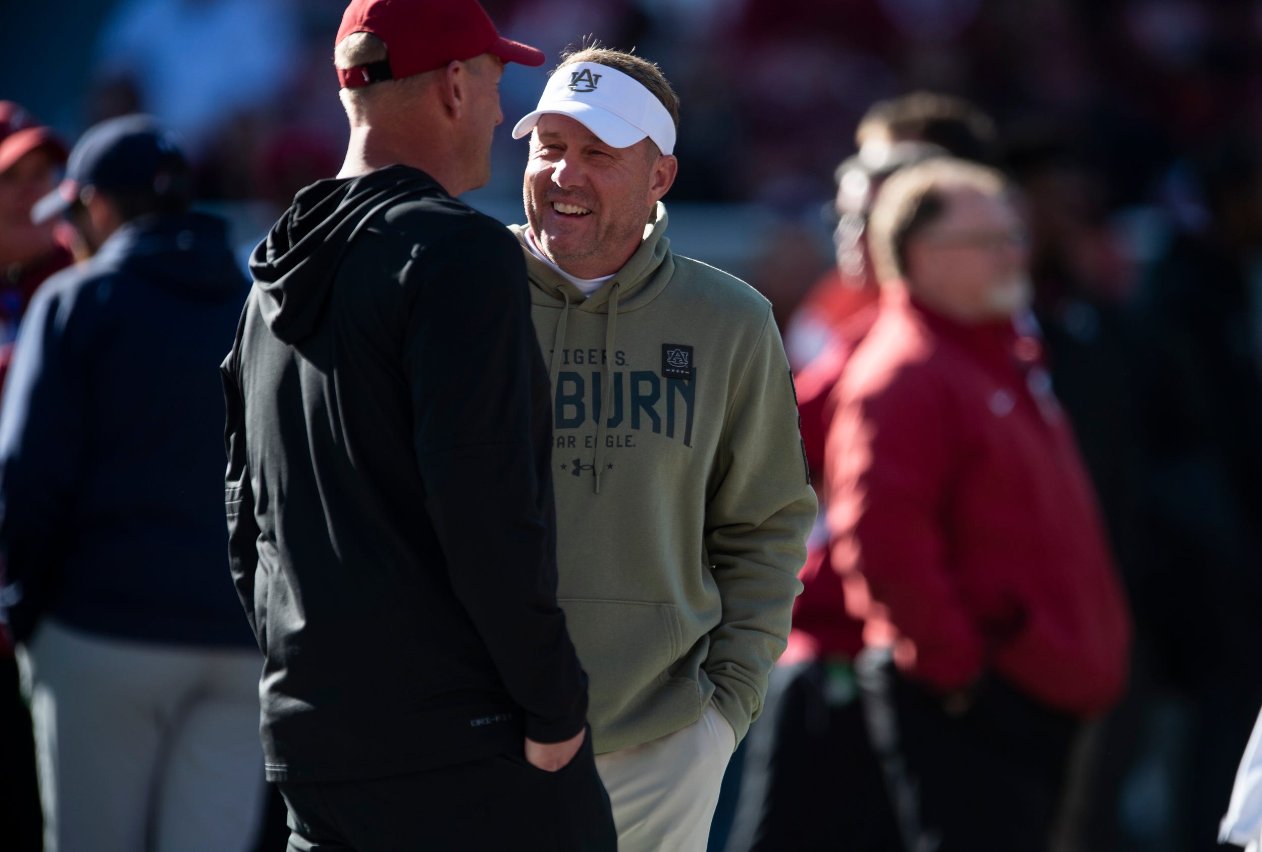 Alabama Crimson Tide head coach Kalen DeBoer and Auburn Tigers head coach Hugh Freeze talk during warm ups as Auburn Tigers take on Alabama Crimson Tide at Bryant-Denny Stadium in Tuscaloosa, Ala., on Saturday, Nov. 30, 2024.