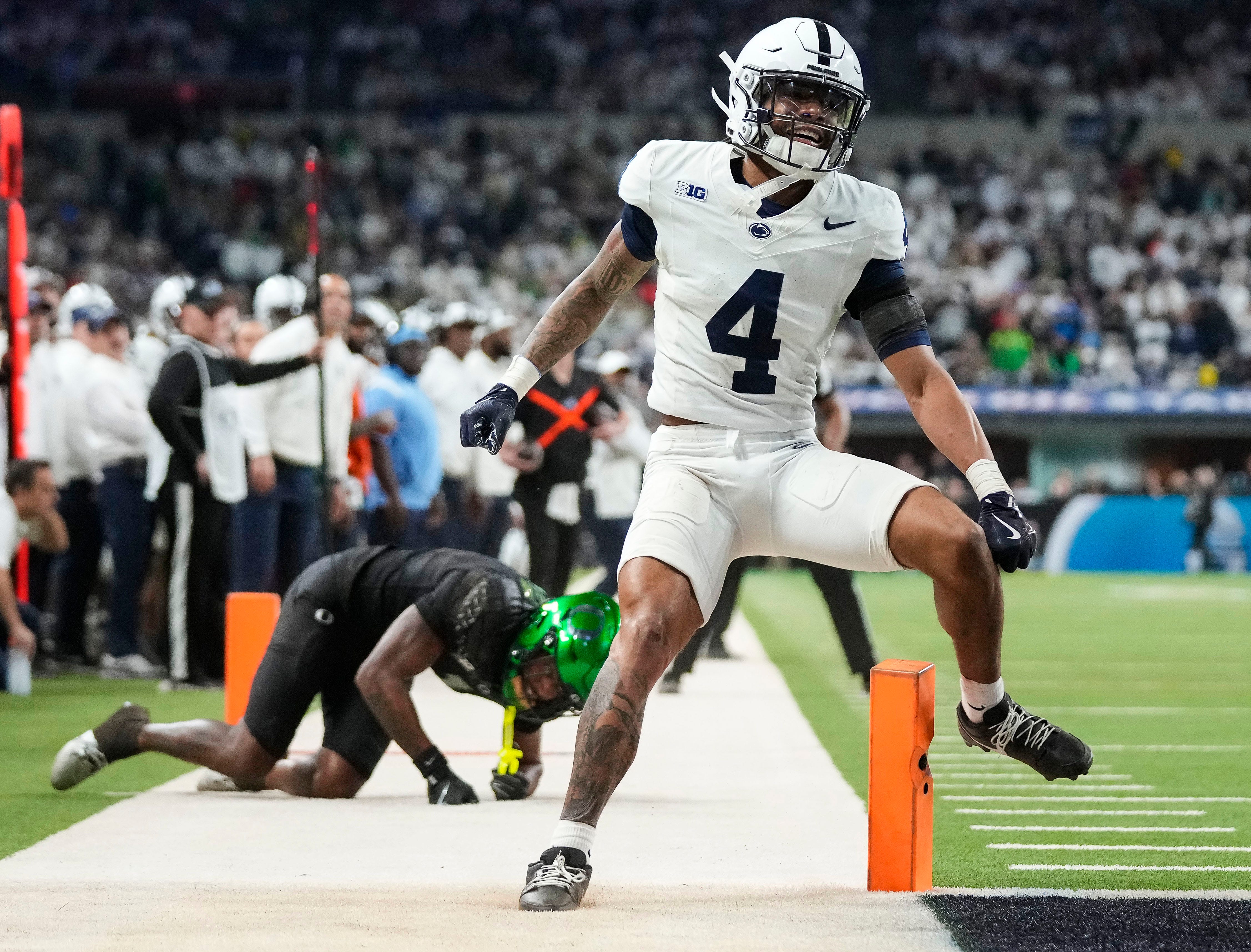 Penn State Nittany Lions cornerback A.J. Harris (4) breaks up a pass Saturday, Dec. 7, 2024, during the Big Ten Championship game at Lucas Oil Stadium in Indianapolis.