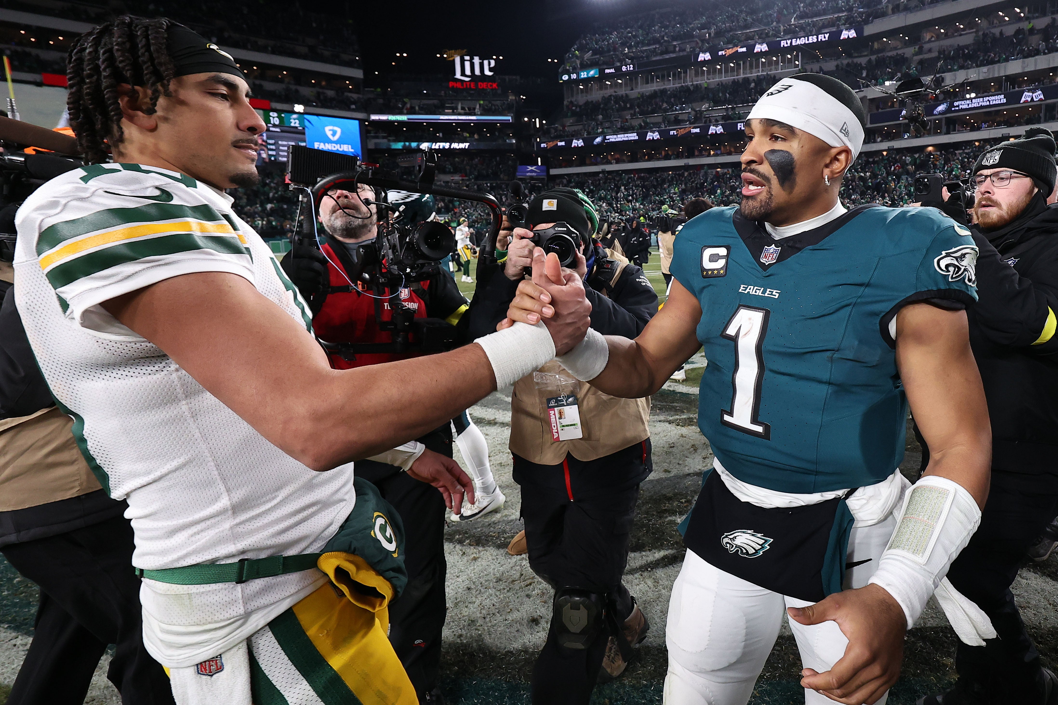 Green Bay Packers quarterback Jordan Love (10) and Philadelphia Eagles quarterback Jalen Hurts (1) shake hands after the game in an NFC wild card game at Lincoln Financial Field.