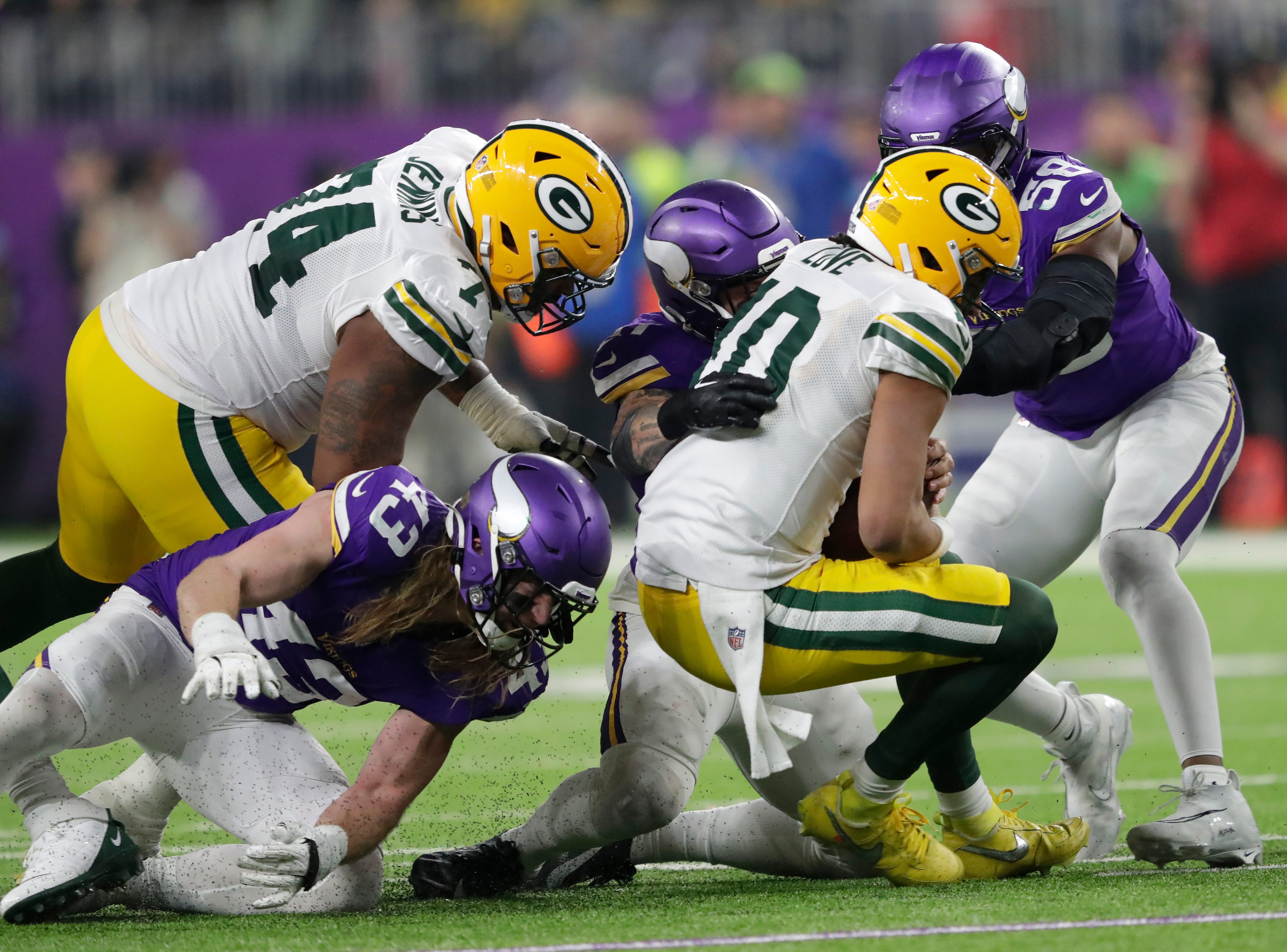 Minnesota Vikings linebacker Blake Cashman (51) sacks Green Bay Packers quarterback Jordan Love (10) in the fourth quarter during their football game Sunday, December 29, 2024, at U.S. Bank Stadium in Minneapolis, Minnesota.