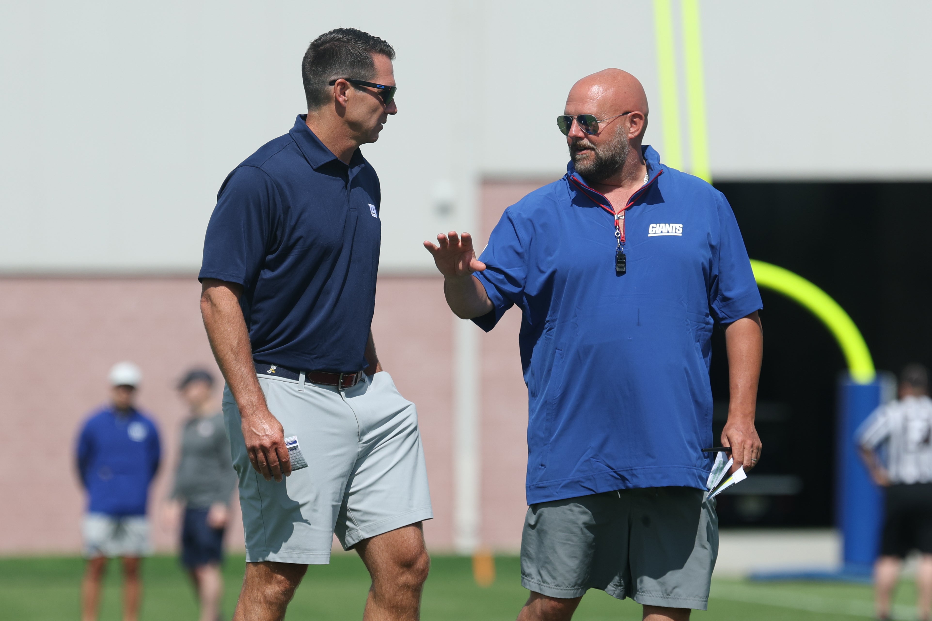 Jul 23, 2025; East Rutherford, NJ, USA; New York Giants general manager Joe Schoen, left, talks with New York Giants head coach Brian Daboll during training camp at Quest Diagnostics Training Center.