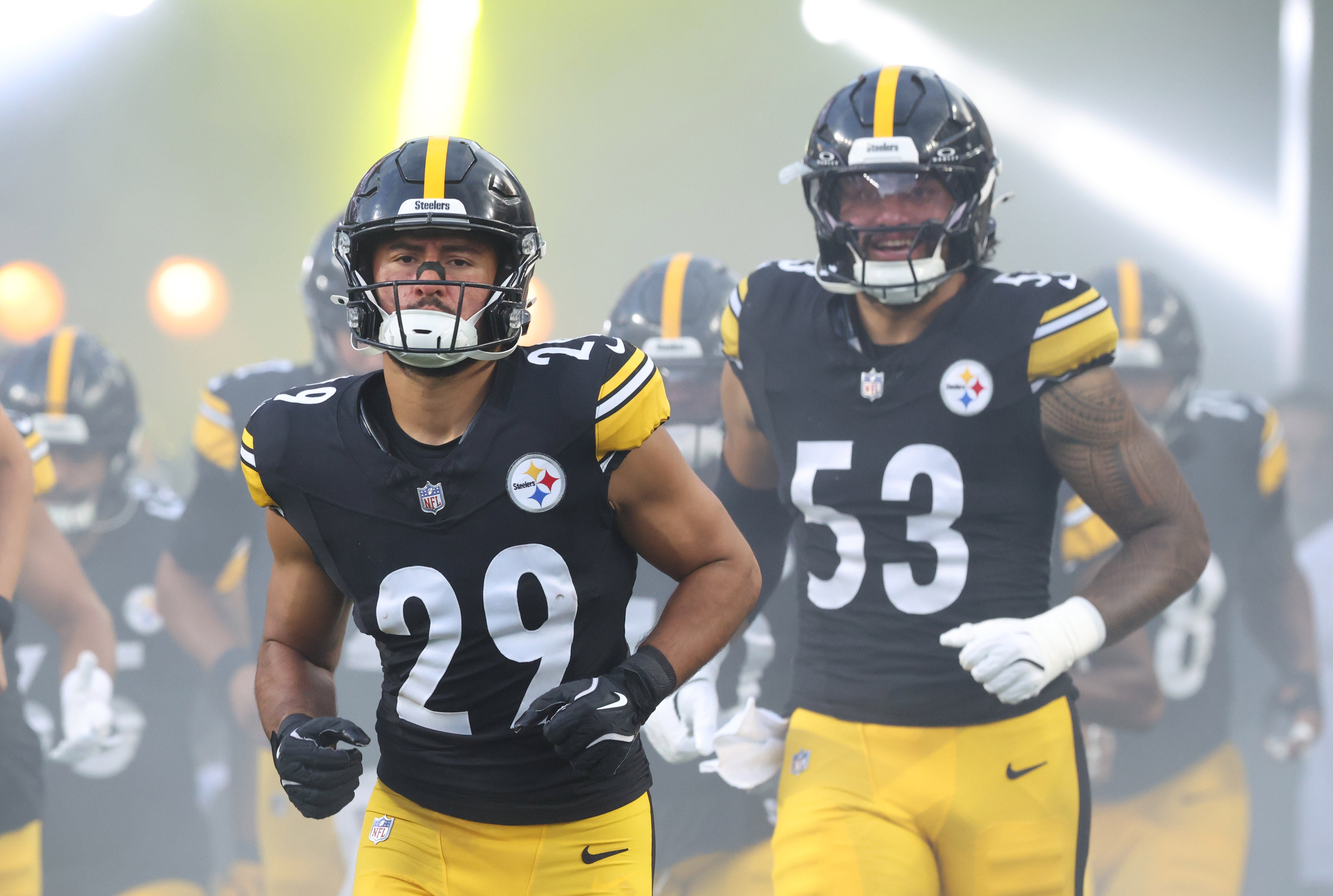 Aug 16, 2025; Pittsburgh, Pennsylvania, USA; Pittsburgh Steelers safety Sebastian Castro (29) and linebacker Eku Leota (53) take the field against the Tampa Bay Buccaneers at Acrisure Stadium.