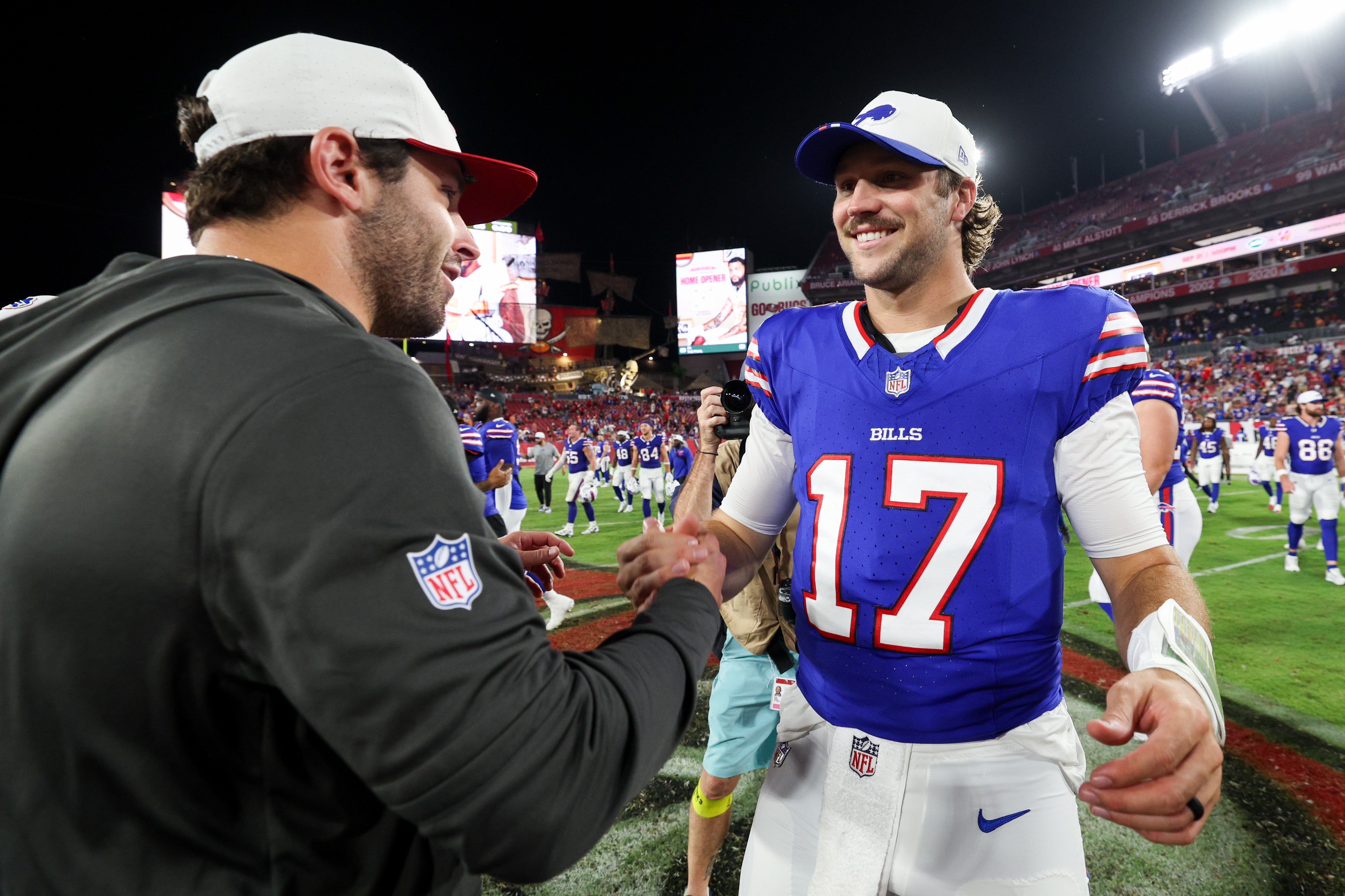 Aug 23, 2025; Tampa, Florida, USA; Buffalo Bills quarterback Josh Allen (17) greets Tampa Bay Buccaneers quarterback Baker Mayfield (6) after a preseason game at Raymond James Stadium.