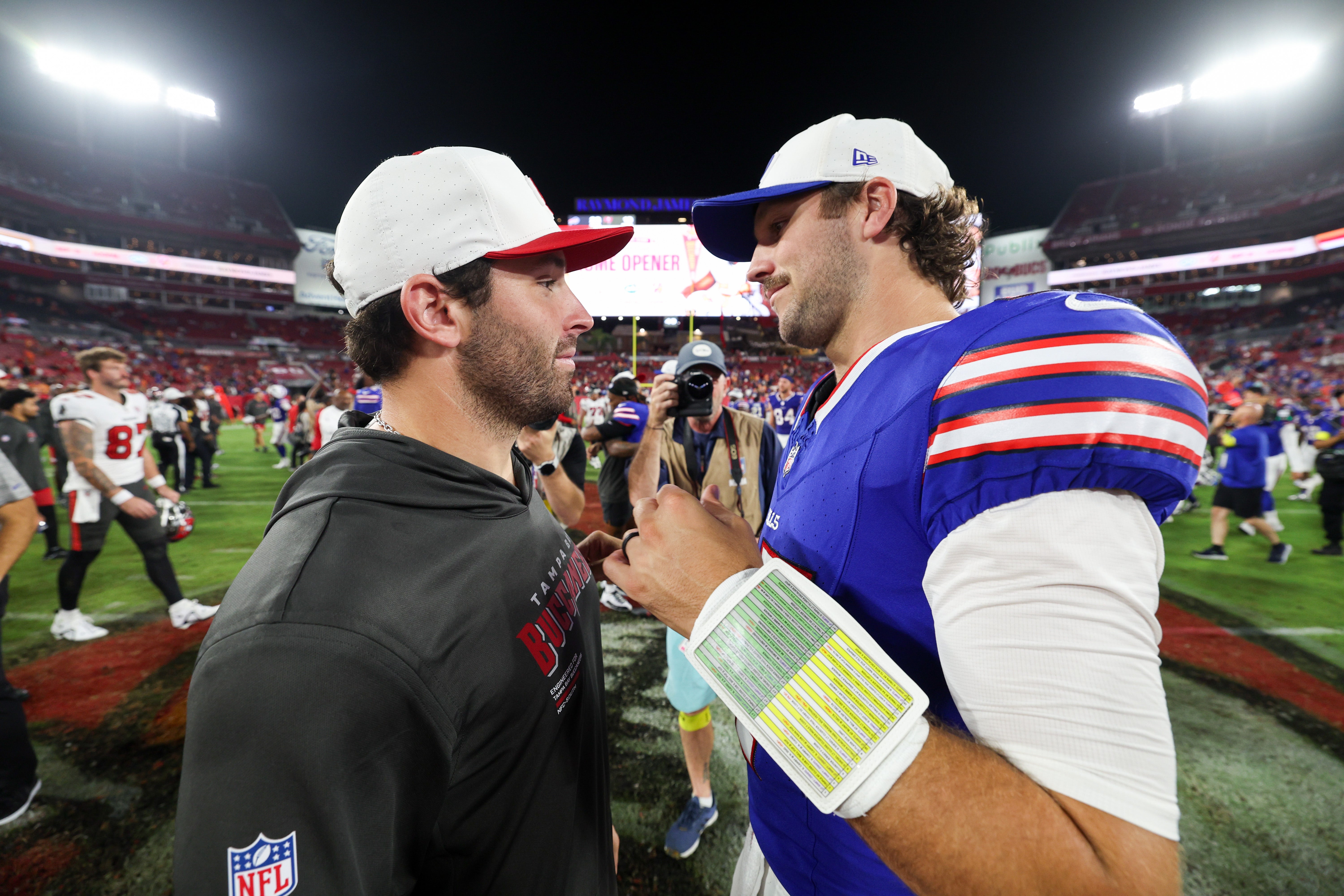 Aug 23, 2025; Tampa, Florida, USA; Buffalo Bills quarterback Josh Allen (17) greets Tampa Bay Buccaneers quarterback Baker Mayfield (6) after a preseason game at Raymond James Stadium.