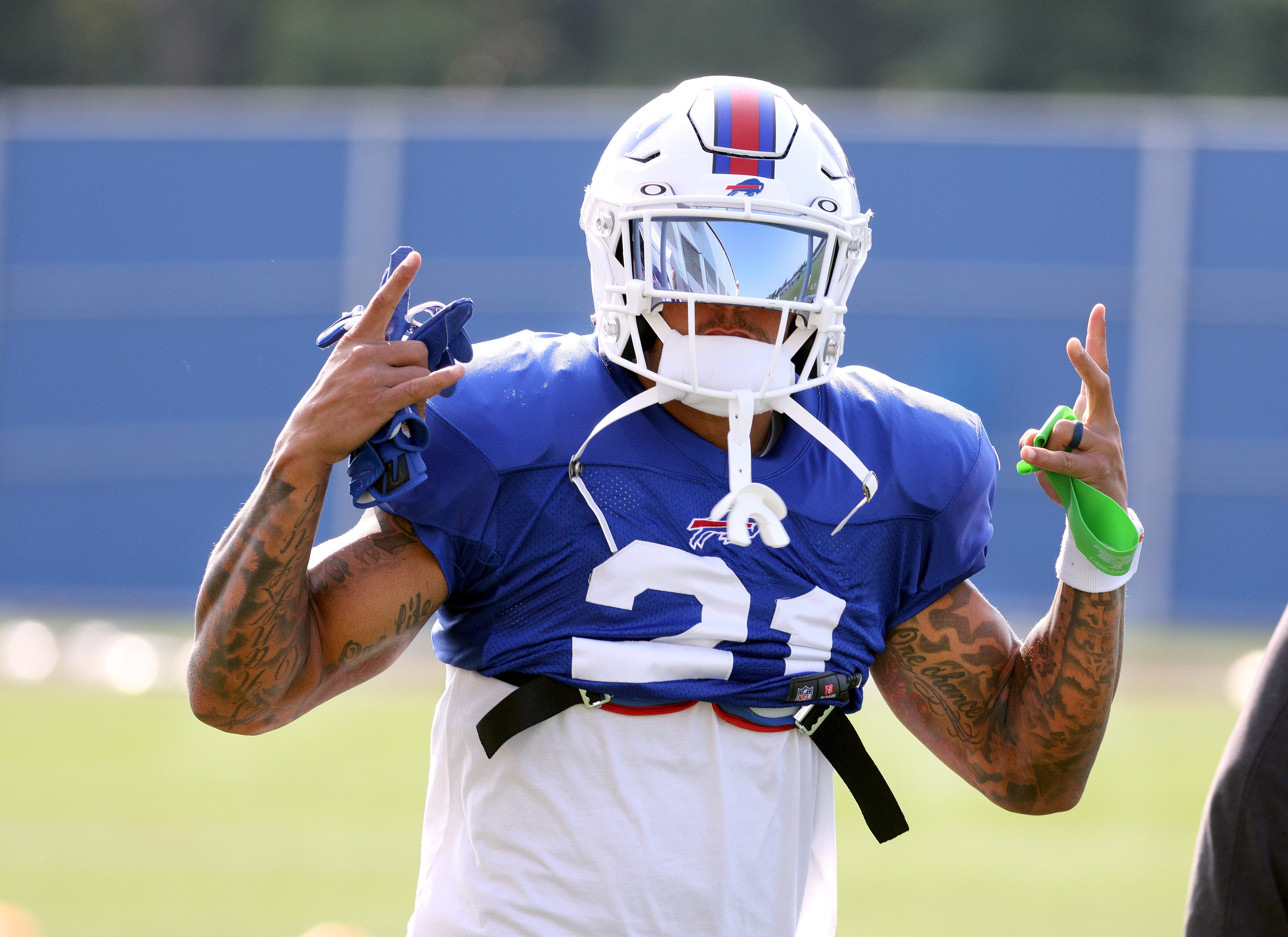 Bills safety Jordan Poyer shares a laugh at the start of practice.